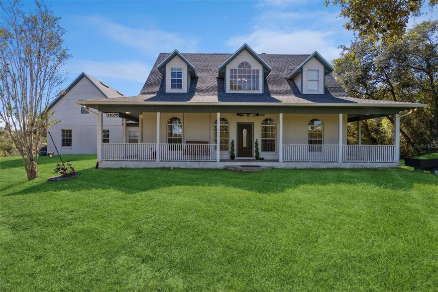 POOL...NO HOA....2.5 ACRES....ZONED FOR HORSES... BONUS ROOM...2900 SQ FT ...WELL/SEPTIC - NO WATER BILL.....Enjoy the quiet as you sit on the swing on this lovely wrap around porch. Camp out on your own private wooded lot - 2.5 acres. This is a beautiful custom built concrete block home on a private road. NO HOA, zoned for horses. Large eat-in country kitchen, formal dining room, double-sided fireplace, 2 walk-in closets in the master bedroom that is located on the first floor, huge pantry, large laundry room with extra refrigerator, bonus room can be used as game/media room or 5th bedroom. New roof in 2022, large solar-heated pool and big area for entertaining, big 2-car garage with lots of shelves and storage (and a work sink). Private lot, yet close to everything. Located near Deltona High school, shopping, and hospitals, it is perfectly situated in the heart of an abundance of outdoor recreational activities, this home is just a short drive to the Daytona International Speedway, Ocala National Forest with over 387K acres of outdoor activities to enjoy including three natural spring pools, head over to Blue Springs State Park where you can enjoy the refreshing 72° water year-round to swim with manatees (Florida's sea-cow), hiking, kayaking and canoeing or grab your boat and head to Lake Monroe, Volusia county's oldest and most popular lake.