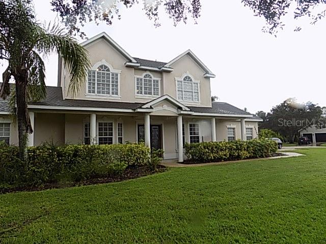 This stunning 4-bedroom, 3-bath home with 3,282 sq ft is located in the highly desirable Mill Creek community and offers spacious, elegant living on a beautifully landscaped ½-acre corner lot. The home welcomes you with double leaded glass front doors that open into a thoughtfully designed floor plan featuring a formal living room, formal dining room, and a large breakfast area. The main living room boasts a cozy fireplace and soaring two-story ceilings, creating a grand yet inviting atmosphere. The primary suite is conveniently located on the first floor and features a luxurious bath with a jetted tub, walk-in shower, and dual vanities. Upstairs, you'll find three additional bedrooms and an open loft that overlooks the family room—perfect for a playroom, home office, or additional living space.
High ceilings, crown molding, and plantation shutters enhance the home's upscale feel throughout. The gourmet kitchen is a chef’s dream, equipped with stainless steel appliances, granite countertops, custom decorative cabinetry, breakfast bar and a large walk-in pantry. Enjoy the Florida lifestyle year-round in the screened lanai with a sparkling pool—ideal for entertaining or relaxing in privacy. Additional highlights include wood floors in the main living areas, a 3-car garage, and a brand-new roof, making this home the perfect blend of luxury, comfort, and functionality.