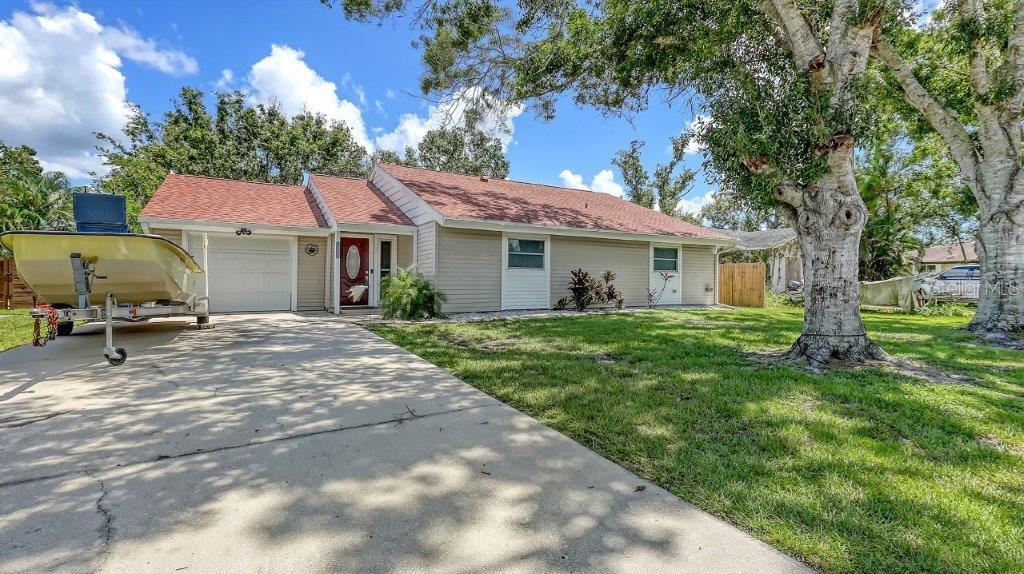 Delightful home is ready for new owners. This 3BR/2BA split plan offers tile and laminate throughout. NEW roof, new water heater, updated baths, and 4-year young stainless appliances and new kitchen cabinets and counters. French doors from primary bedroom lead to back porch. The oversized 1 car garage offers a new garage door and a semi-finished area that could be converted to a nursery or reading room with door off the primary bedroom. The back yard is fabulous with oversized concrete patio, fire pit and wood fence. Close to I-75, shopping, banking, restaurants, Home Depot and more.