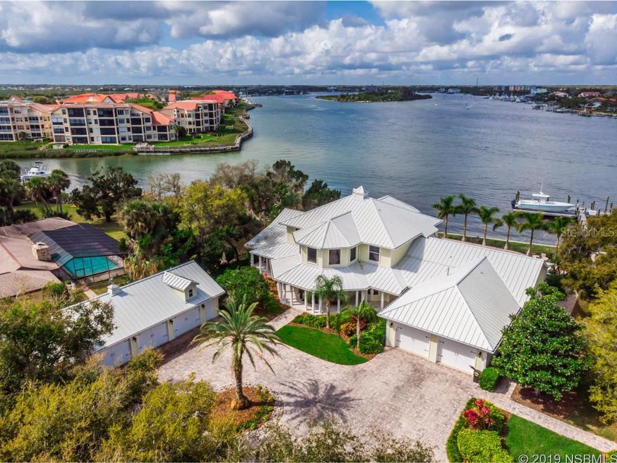 Ultimate Florida Coastal Living! Walk to one of the best beaches on the East Coast OR to hopping Flagler Ave OR jump on your boat in the backyard and be to Ponce Inlet in 10 minutes. Over the past 3 years, this property has been carefully updated and brought to life. This Rare Find features a 1 Acre Lot with 150' on the ICW, a detached 4 Car Garage + 2 Car attached garage, lush tropical landscaping, a Pool & Spa and brand new Dock and No Profile lift. Perfect for Entertaining, enjoy spectacular sunset views from the covered wrap-around porches, patio w/ wet bar and paver pool deck. The home features 3 en-suite bedrooms, 5.5 baths, a huge upstairs loft, an upstairs exercise room/office/bedroom, and a downstairs bonus room perfect for a guest suite or game room. The Master Suite offers two large his-and-her closets, and a spa-like bathroom with a double vanity, claw foot tub, large shower and beautiful French doors leading out to the wrap-around porch with amazing riverfront views. The open concept living areas create a comfortable, casual feel with the huge gourmet kitchen being the focal point. This one-of-a-kind riverfront estate is being offered furnished. List of specific included items available upon request - artwork does not convey. Also - separate list of updates and special features available upon request. ;Water: City