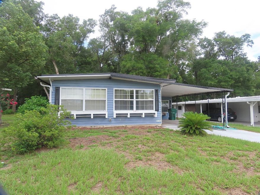 Just Updated A Lot of Home for the Money
This large home was just Updated with new Flooring and Kitchen Appliances and it has a Bonus Front Room and a Florida Room and a Screened Back porch, A large Storage Shed with a new Washer and Dryer, Homes backs up to a peaceful Treed area, The community has many great amenities Clubhouse, Pool, Shuffleboard and more Possible Owner Financing