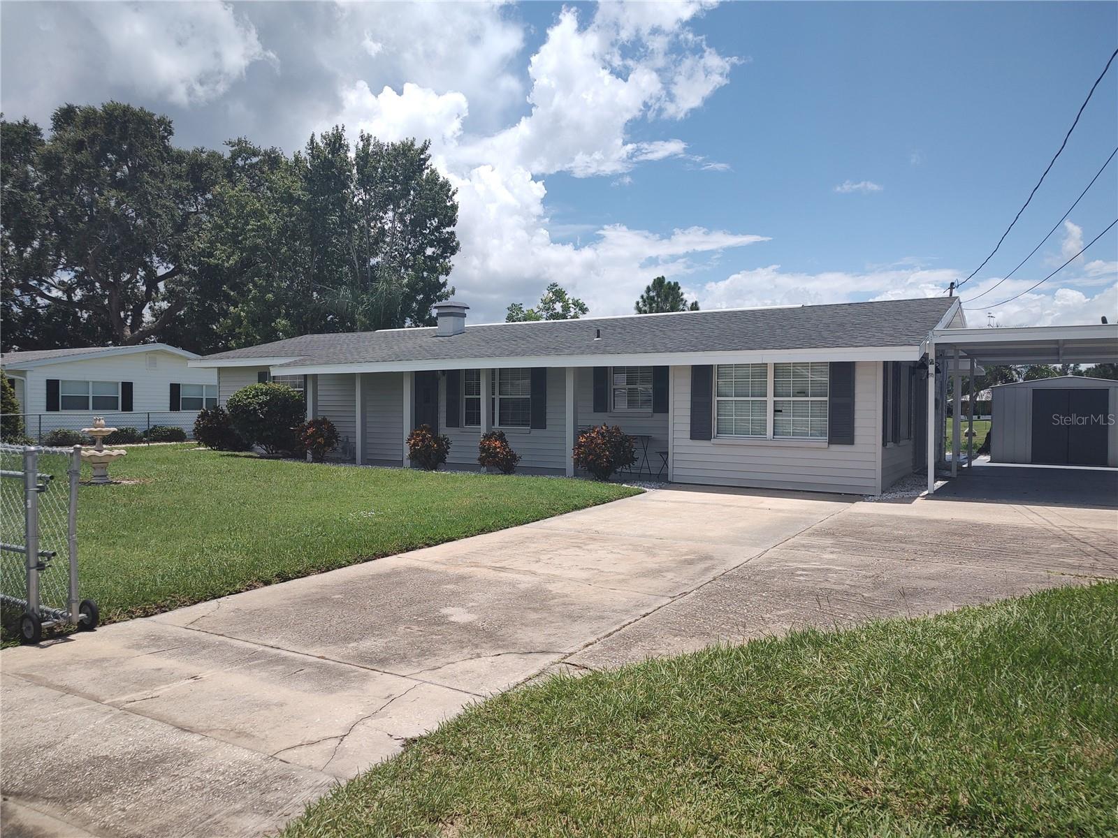 MOVE IN READY 2 BEDROOM /1 BATH CANAL FRONT HOME LEADING TO PRISTINE CROOKED LAKE- ONE OF POLK COUNTY'S MOST SOUGHT AFTER FRESH WATER LAKES. CLOSE TO ELEMENTARY, MIDDLE, AND HIGH SCHOOLS AS WELL AS PROXIMITY TO 2 COLLEGES. ENJOY MORNING COFFEE OR AFTERNOON COCKTAILS ON THE LARGE SCREEN PATIO OVERLOOKING THE CANAL THAT FEEDS INTO CROOKED LAKE. THE PROPERTY IS FENCED ON 3 SIDES. THE MASTER BEDROOM HAS LAMINATE FLOORING AND FRENCH DOORS THAT LEAD TO CANAL FRONT. THE SECOND BEDROOM HAS LAMINATE FLOORING. THE KITCHEN HAS QUARTZ COUNTERS, LAMINATE FLOORING, STAINLESS STEEL SINKS, ELECTRIC STOVE, DISHWASHER, SIDE BY SIDE REFRIDGERATOR AND MICROWAVE. ALL APPLIANCES ARE STAINLESS STEEL AND ARE IN EXCELLENT LIKE NEW CONDITION. THE BATHROOM HAS A DOUBLE VESSEL SINK WITH QUARTZ COUNTERTOP AND CERAMIC TILE SHOWER. THIS HOME HAS A LARGE FAMILY ROOM FEATURING 2 SETS OF FRENCH DOORS THAT LEAD TO BACK PATIO OVERLOOKING CANAL. SMALL OFFICE SPACE. INTERIOR UTILITY ROOM WITH A WASHER DRYER AND ELECTRIC HOT WATER HEATER. HOME HAS LAMINATE AND SOME TILE FLOORING. NICE CURB APPEAL WITH ESTABLISHED PLANTS. THERE IS A METAL 8X10 SHED AT THE END OF CARPORT SLAB. SOME FURNITURE WILL BE LEFT INCLUDING DINING ROOM TABLE AND 4 CHAIRS. NO MANDATORY HOA. HOME IS ON A NICE QUIET STREET IN CROOKED LAKE PARK. CALL TODAY TO PREVIEW THIS BEAUTIFUL HOME.