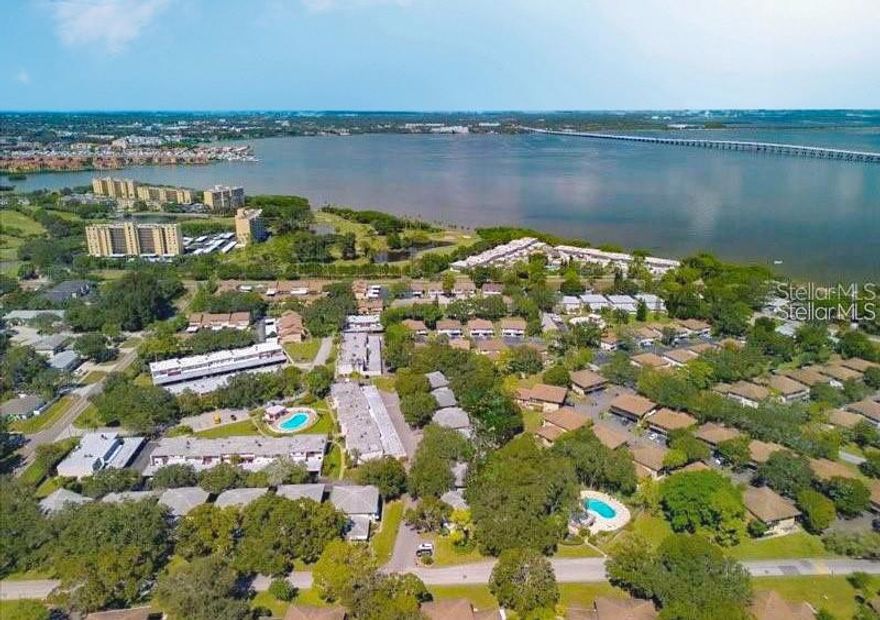 Welcome to paradise at Eastwood Shores. This condo is a Two bedroom and One bathroom with a shared garage located on 2nd floor with your own private staircase to the front door. This condo features mahogany kitchen cabinets, granite countertops, tile backsplash, white appliances, full size washer & dryer, high & vaulted ceilings, HUGE great room with accent brick wall and electric fireplace, ample closet space throughout and MASSIVE balcony that connects from great room and 1 of the bedrooms. Tile floors throughout and laminate floors in both bedrooms located on 2nd floor w/covered balcony overlooking the community. Rent Includes: Trash, Water & Sewer and 1 car garage. Eastwood Shores amenities sparkling swimming pool, tennis court, fishing pier, trails and tucked away in the back of the community is a peaceful walk to the Long Branch Creek observation deck, great for fishing! Close to both TIA & St Pete airports, easy access to 60, US19, Tampa, St Pete, award winning beaches, entertainment, shopping, Golf Courses, and a large variety of restaurants!