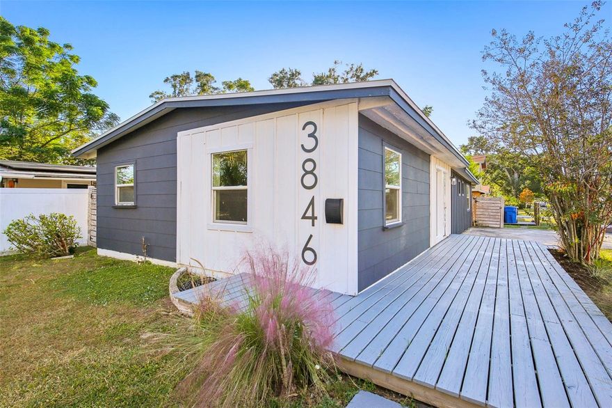 Welcome to this beautifully remodeled 1957 mid-century modern home that perfectly blends classic character with modern elegance. Featuring 3 bedrooms and 1 bathroom, this home has been tastefully updated with a stunning open-concept kitchen that flows seamlessly into the living room, complete with a large butcher block breakfast bar, sleek white and gray cabinets, new quartz countertops, and stainless steel appliances and fixtures. The remodeled bathroom offers stylish new tile throughout and a deep soaking tub for relaxation. Enjoy luxury plank vinyl flooring for easy maintenance, fresh interior and exterior paint, newer windows, sliding glass doors, and decks, plus a brand-new roof installed in 2022. Step outside to your private backyard oasis—lush, green, and fully fenced—perfect for entertaining or unwinding by the fire pit. The inviting front porch with a brand-new deck and fresh landscaping adds the perfect touch of curb appeal. Ideally located near top-rated schools, shopping, downtown St. Pete, and award-winning beaches, this move-in-ready home truly has it all.