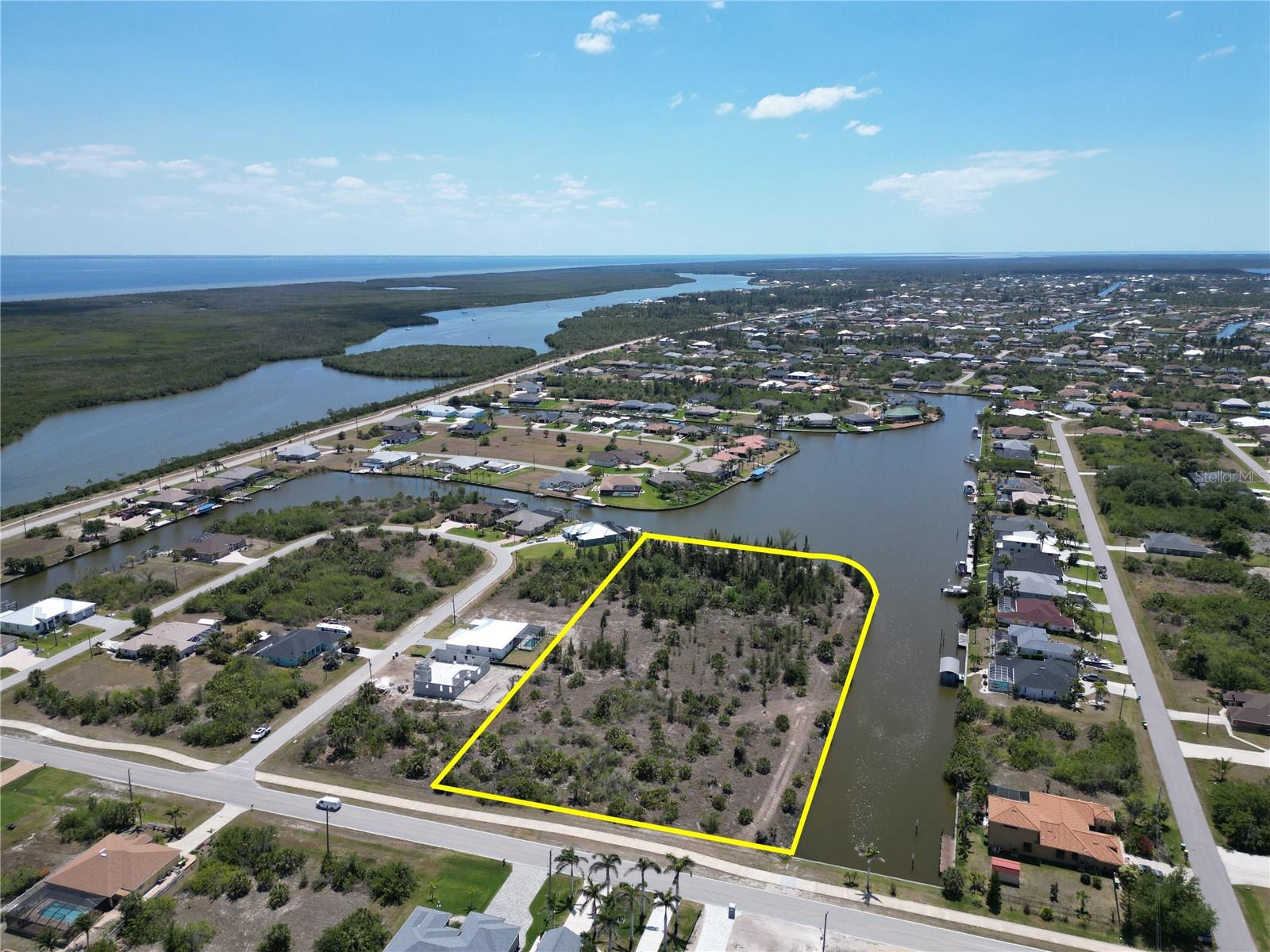3.97 +/- Acres located on the Burwell Waterway with roughly 845 feet of concrete seawall in place. Great location for a Yacht Club... Access to the Charlotte Harbor and the Gulf of Mexico. All Utilities are in place making this a Prime Location for Development to service the over 4,000 waterfront homesites and over 9,000 interior homesites within the community of South Gulf Cove. Roughly 5,000 existing homes and growing fast. Property is located on a large deep water basin with only one bridge to open water. New Home Construction has been Booming in the Community over the past several years creating a huge demand for services for all of the new residents in the Community. Future Land Use is Parks & Recreation - Not Suitable for Residential - Allowable Uses are in the attachments. Contact Charlotte County for Zoning and Land Use. Perfect Location for a Yacht Club; 40 +/- docks, recreation area outside, clubhouse and hospitality services. Bring Offers - Motivated Seller
