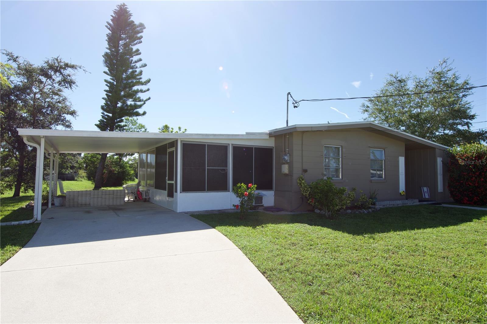 This charming 2-bedroom, 1-bath block home is full of potential, value and move-in ready! Situated on a spacious corner lot, this well-maintained property is ideal for first-time homeowners, investors, or snow-birds looking for a comfortable Florida retreat. With new LUXURY VINYL FLOORING and a NEW ROLLED ROOF, this home is PRICED TO SELL!
Inside, enjoy a cozy, functional layout with two comfortable bedrooms, a full bath, and a comfortable living area. The enclosed sunroom provides versatile bonus space—ideal for entertaining or a relaxing spot to unwind.
Located in a quiet neighborhood just 10 minutes from the North Port Aquatic Center, 25 minutes to Manasota Key Beach, and 35 minutes to Punta Gorda Airport, this home offers convenience to both recreation and travel.
Solid block construction, a private corner lot, and low-maintenance living make this property a smart investment or an easy-care seasonal home.