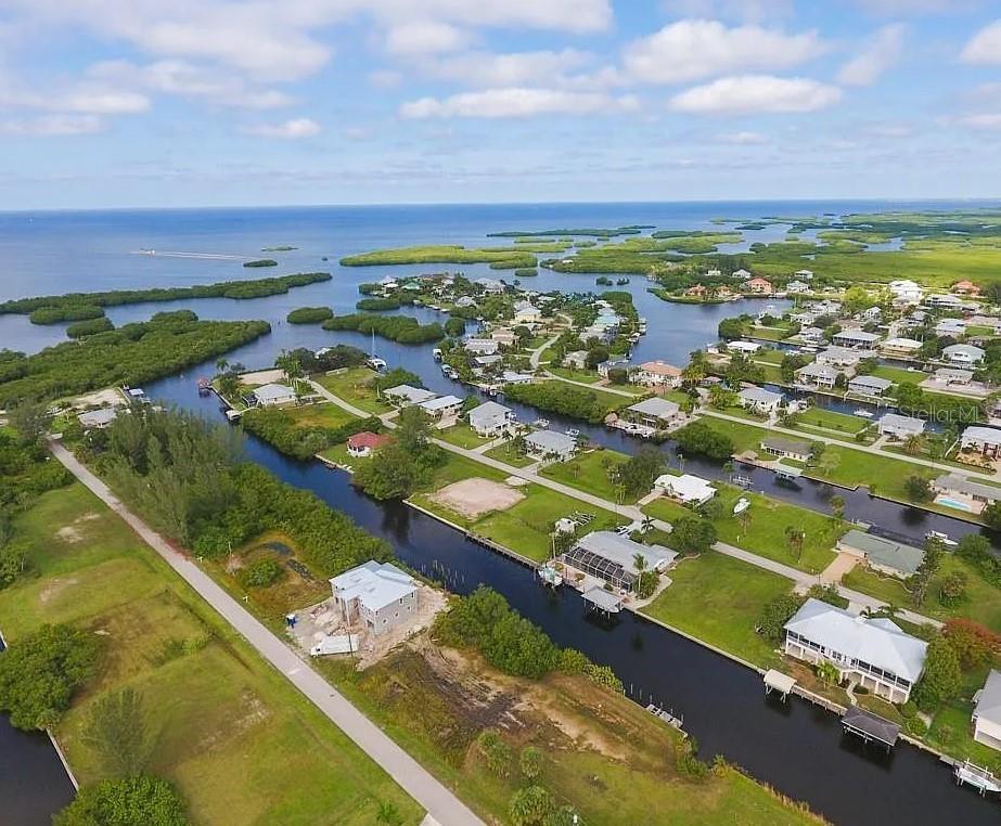 Build your dream home on this 0.25-acre waterfront lot in the highly desirable community of Pirate Harbor. Survey available. Only 20-minute sailboat access to the Gulf of Mexico. Featuring quick easy access with no bridges to Charlotte Harbor & the Gulf of Mexico. Convenient to shopping and restaurants in both Punta Gorda and Cape Coral. Numerous golf courses nearby and short drive to the Punta Gorda Airport or Southwest Florida International Airport. Great time to build or invest for the future.