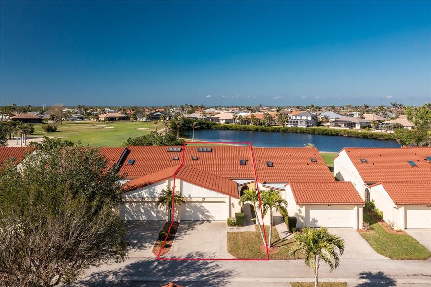 WOW!! Is what you will say when you see this beautiful Punta Gorda Isles Golf Course Villa for only $189,900 and monthly fees of only $660! This Villa has never experienced any interior damage or flooding in any past hurricanes, and the seller is an original owner. It is a spacious 2 bedroom plus a large den/bonus room, 2 bathrooms, 2 lanais and a 2-car garage. The back lanai has a wonderful southwest exposure overlooking the lovely lake, St Andrews Golf Course (with available memberships) and incredible sunsets! It also has Glass Sliders for the cool winter days and accordion hurricane shutters on the exterior. The front screened Porch-Patio is nice and private with brick paver flooring; this would be a great spot for the large Grille and another seating or even a hot tub! The interior has an all-white tile floor that would go with any decor. The kitchen has granite counters, white appliances with built in microwave, flat top stove and large refrigerator with an icemaker. There is also room for a breakfast nook! The closet in the kitchen houses the washer, dryer, hot water heater and some storage. The large great room shares the lovely view off the Lanai as well. It also has cathedral ceilings with 7 skylights throughout and built in cabinets for your dining area! The primary bedroom has 2 walk-in closets with the larger having been upgraded with a California closet design style. Both baths have granite counters. The 15X11 bonus room/den-study is such an added bonus and includes a large skylight to make it light and bright. Golf Course Villas (the name of the condominium) has a large pool, shuffleboard courts and a quaint gazebo for all to share. New Metal Roofs installed in 2024 with the $9,650 Assessment paid in full. All exterior buildings have been painted in 2025, and the private road has been repaved in February 2025. Great time to be buying in this well maintained complex and enjoy living the good life Punta Gorda has to offer! Great neighbors are an added bonus! Call today to see as this won't last long!