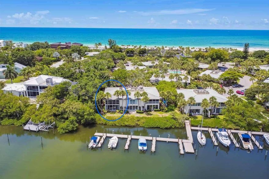 Welcome to 6700 Gulf of Mexico Drive #117, a beautifully reimagined end-unit 2-bedroom, 2 full bath residence in the sought-after Whitney Beach community on Longboat Key. Taken down to the studs and completely renovated, this waterfront condominium offers coastal living with sweeping views of Bishop’s Bayou, abundant natural light, and exceptional privacy. A private front courtyard welcomes you inside, where new high-end luxury vinyl plank flooring flows throughout and a bright, open layout immediately draws your eye to the water. As an end unit, additional windows enhance the airy feel, while hurricane-impact windows and sliding doors frame tranquil bayou views. From the main living space—and even from the primary bedroom upon waking—you’ll enjoy peaceful scenes of dolphins, manatees, and glowing sunsets that reflect across the water. The fully redesigned kitchen features quartz countertops, custom glass-front cabinetry, classic subway tile backsplash, designer pendant lighting, brand-new stainless-steel appliances and peninsula seating for four, all positioned to capture the water views. Both bathrooms have been completely renovated with glass walk-in showers, elegant tilework, and quartz-topped vanities, offering a clean, modern aesthetic. A brand-new full-size washer and dryer adds everyday convenience. Whitney Beach is a unique beach-to-bay community with deeded private access to the Gulf just across the street. Residents enjoy resort-style amenities including two pools, tennis courts, shuffleboard, barbecue areas, kayak storage and launch, walking paths, and a tranquil bayfront pavilion. Boat slips are available when offered, and the community pier provides a charming setting for fishing or relaxing by the water. Ideally located on the north end of Longboat Key, this residence offers easy access to Anna Maria Island, as well as the dining, shopping, and cultural attractions of Sarasota. Whether as a full-time home, seasonal retreat, or investment, this is an exceptional opportunity to enjoy the best of bay-to-beach living. Professional photos coming soon.