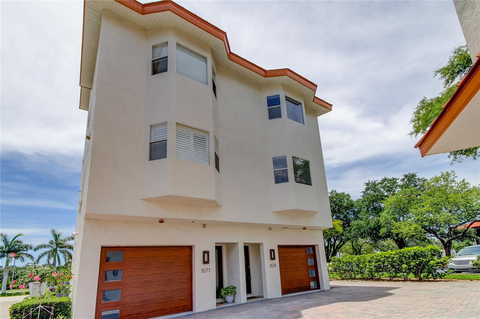 TROPICAL PARADISE Awaits you on the "ISLAND OF TIERRA VERDE"! Desirable Community of Tierra Del Mar! SPACIOUS TOWNHOME with 2,100 Heated Square Feet of Living! 3 Bedrooms PLUS Office or Bonus Room, 3.5 Bathrooms with 1 Car Garage and AMAZING ROOF TOP LANAI Overlooks a Western View with SPECTACULAR SUNSETS! ENJOY A GULF BREEZE over Boca Ciega Bay! Spot Dolphins, Manatees and Osprey! Light, Bright and Beautiful! DOWNSTAIRS PRIVATE "EN SUITE" Bedroom for your Guests or In Laws! Great Room Floor plan Features Beautiful Real Hardwood Flooring as well as in Dining Room, Kitchen and Stairs! Owners Retreat has Walk in Closet! and Bathroom Features Double Sinks and Walk In Shower! Marble Flooring and Countertops! Inside Laundry Closet with WASHER AND DRYER INCLUDED! Ceiling Fans Throughout! Neutral Decor! Plenty of Storage! 2 Air Conditioners! Security System! Pavered Driveway! PEACEFUL COMMUNITY of 8 Townhomes Featuring FABULOUS RESORT STYLE POOL Shared with Hidden Lagoon Community Next Door to the South. This WATERFRONT COMPLEX Offers Some of the BEST FISHING in the County! KAYAKING and PADDLE BOARDING! Boat Slips may be Available from Other Owners to Lease. RIDE YOUR BIKE to Historic Fort Desoto Park, One of the #1 Beaches in the U.S.! Just 5 Miles to the Sugar Sands at ST. PETE BEACH! Close to Nearby Restaurants and Shopping! Great Location! World Renowned "Don Cesar" Hotel nearby! Easy access to Tampa International Airport! Fully Furnished or Unfurnished if Desired. CLEAN AND COMFORTABLE! Includes: Ground Maintenance, Community Pool and Trash. Must See Inside to Appreciate! You Will Want to Stay Forever and Call it your Home! LANDLORD MAY CONSIDER RENTING PROPERTY UNFURNISHED! LANDLORD MAY CONSIDER A PET! OPTIONAL SEASONAL RENTAL!
