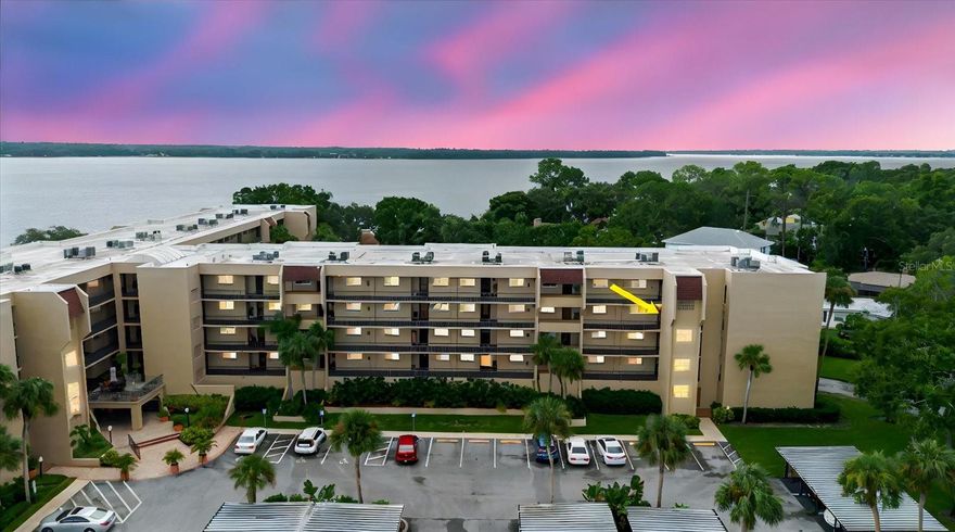 Discover the perfect blend of comfort, convenience, and Florida charm in this beautifully updated, move-in ready 3rd-floor condo. Tucked safely in a no-flood zone and paired with a low HOA fee, this home is designed for easy living and peace of mind. Offering 2 bedrooms, 1 bath and a deeded covered parking spot, plus extra storage, this condo truly has it all. Inside, you’ll find a bright, open floor plan where the kitchen, dining, and living areas flow seamlessly together, ideal for both entertaining and everyday living. The spacious master suite features access to the private balcony, while the second bedroom is equally inviting with plenty of natural light. The living room also opens to the balcony, where you can relax with serene lake views. Convenience is key here, an elevator in the building ensures easy access, while impact windows add extra comfort and security. Step outside and enjoy the resort-style amenities that make this community so desirable. Spend your days lounging by the heated pool, staying active in the fitness center, or enjoying a game of tennis, pickleball, or shuffleboard. Unwind with a book in the library, challenge friends at billiards, or host gatherings in the clubhouse. Love the out doors? Take advantage of the BBQ area, go fishing on Lake Tarpon, or enjoy boating and skiing with access to private docks and slips. The HOA covers water, sewer, trash, exterior maintenance, insurance, and full access to recreational facilities, ensuring easy ownership. Located just minutes from Tarpon Springs’ historic Sponge Docks, downtown shops and dining, pristine beaches, golf courses, parks, hospitals, and the Pinellas Trail, this condo offers both convenience and charm, making it the perfect place to call home or use as a seasonal retreat. Don’t miss the chance to enjoy the Florida lifestyle you’ve been dreaming of!