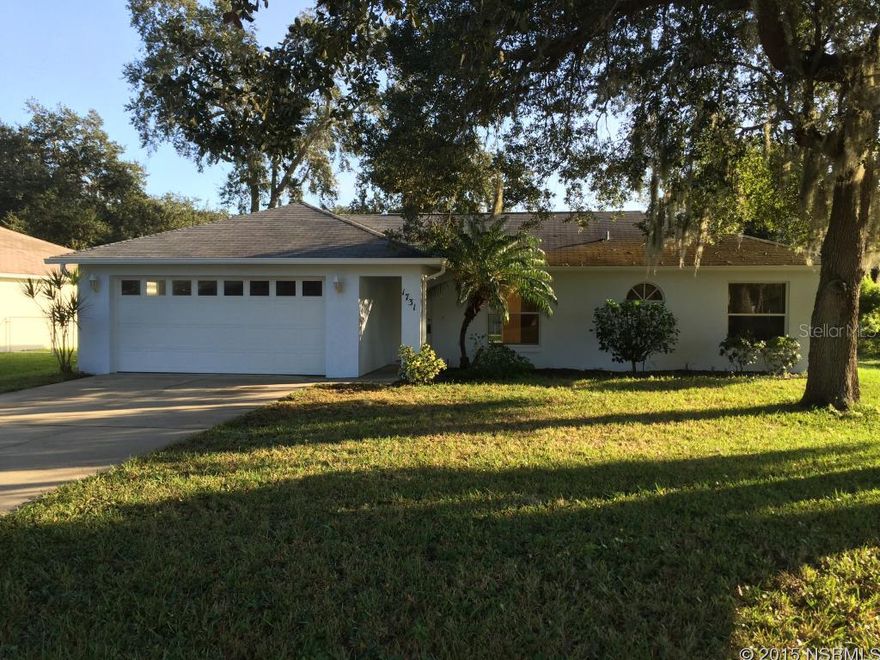 Bright and airy 3 bedroom 2 bathroom split floor plan home with a 2 car garage and no immediate neighbors to the south. Located in a convenient and well maintained section of the Florida Shores subdivision. This move-in ready home was built in 2002 and features laminate and tile flooring throughout, an inside laundry area, hurricane shutters, and a large backyard with room for a pool & entertaining. ;Water: City