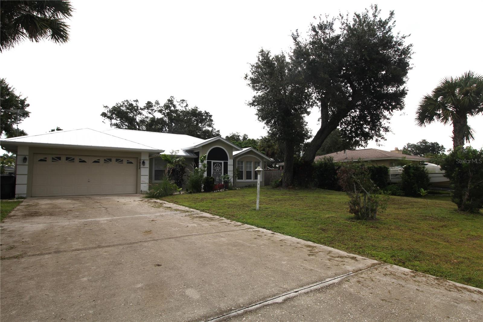 Great rental on city water. High ceilings, all tile, and an enclosed lanai. Nice-sized back yard, and only minutes from shopping and restaurants.
