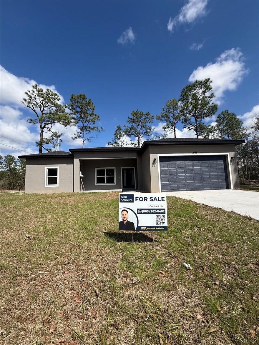 Welcome to this beautifully designed new construction home located on an oversized corner lot in desirable Citrus Springs. This modern residence offers an open-concept layout with 3 bedrooms and 2 bathrooms, featuring soaring 10-foot ceilings and a sleek flat ceiling design that enhances the sense of space and natural light throughout the home.

The interior showcases premium 20-mm luxury vinyl flooring throughout the main living areas, combining durability with an elegant modern look. The spacious kitchen flows seamlessly into the living and dining areas, creating the perfect space for entertaining or everyday living.

The primary suite offers comfort and privacy, while the additional bedrooms provide flexibility for family, guests, or a home office.

Step outside to enjoy the large covered lanai, ideal for outdoor dining, relaxing, or hosting gatherings year-round.

Additional highlights include an oversized lot, corner lot positioning for extra privacy, a garage with 8-foot height, and a modern electronic smart lock system for convenience and security.

Conveniently located near parks, schools, shopping, and the natural beauty that Citrus Springs is known for. This home offers the perfect combination of modern design, comfort, and Florida lifestyle.

Schedule your private showing today.