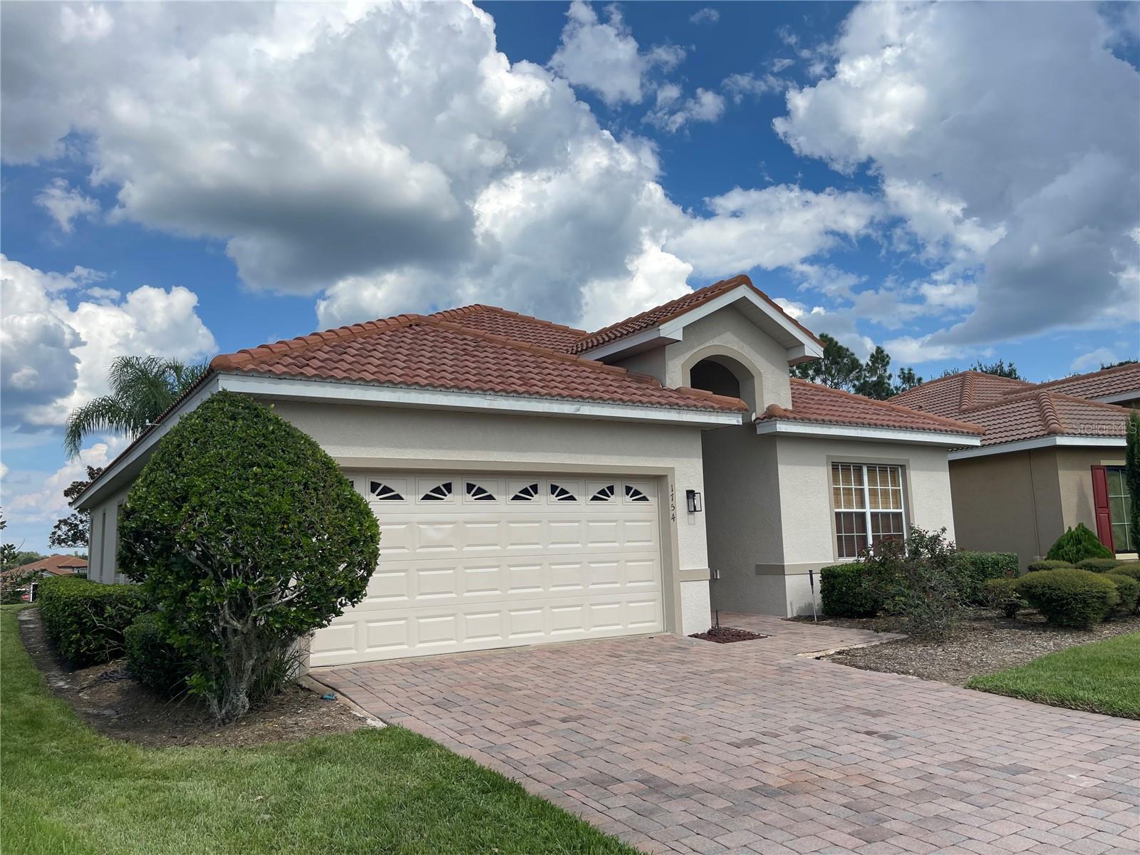 Welcome to the most popular Milano model in TerraLargo, Lakeland’s premier gated community! This stunning home is packed with upgrades and offers both elegance and comfort in a resort-style setting.
The heart of TerraLargo is its breathtaking 5,000 sq. ft. clubhouse, designed with a Renaissance-Tuscan flair. Overlooking a sparkling lake, the clubhouse features a sculpted zero-entry pool and spa, lushly landscaped courtyards with stone benches and columns, a shaded playground, and a boardwalk with gazebo on Meadow View Lake—perfect for fishing, kayaking, or simply relaxing and soaking in the views.
Inside the home, the master suite is truly fit for a king, with soaring vaulted ceilings, a massive walk-in closet, and private access to the lanai. The spa-like master bath boasts a garden tub, separate shower, and dual vanities. With 3 spacious bedrooms and 2 full bathrooms, this layout is designed for both functionality and comfort.
Residents of TerraLargo enjoy incredible amenities, including a state-of-the-art fitness center with TechnoGym equipment (each with its own personal TV and radio) and even a playroom viewable from the gym, so parents can work out while the kids play. The HOA includes Bright House premium cable, clubhouse access, and full use of all community features.
Conveniently located just minutes from I-4, commuting to Tampa or Orlando is a breeze. Add in the peace of mind of a fully gated, monitored entrance, and you’ve found a community—and a home—that truly has it all.