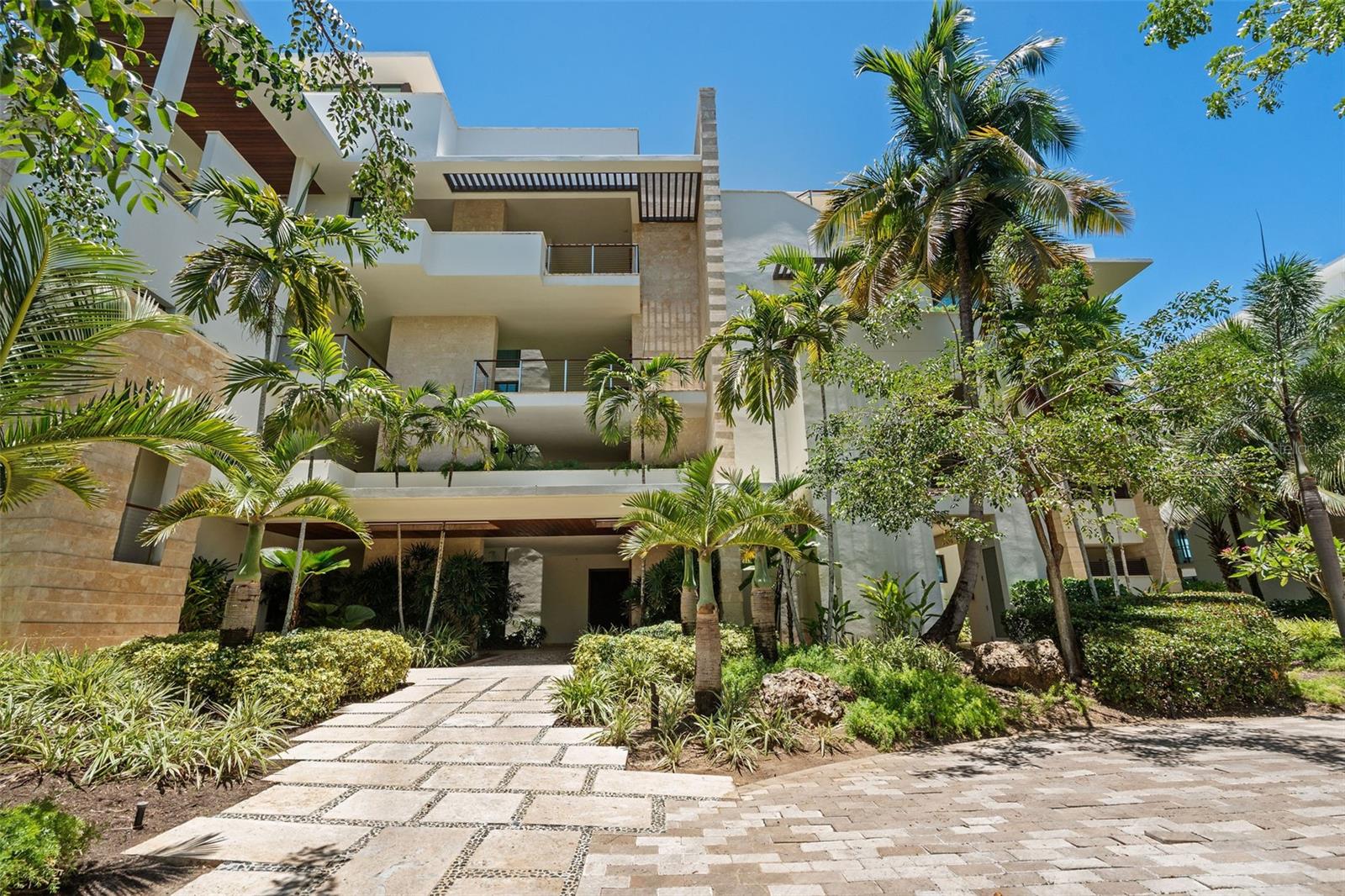 Set along the shoreline of one of the Caribbean’s most celebrated destinations, this exclusive beachfront residence at West Beach Residences in Dorado Beach, a Ritz-Carlton Reserve, offers a lifestyle of quiet luxury and seamless connection to nature. Located on the third floor, the home enjoys panoramic ocean views and direct access to a secluded stretch of sand, all within the privacy and prestige of a Ritz-Carlton Reserve community.
The layout is designed with both comfort and sophistication in mind. Four spacious bedroom suites each feature a private bathroom and generous walk-in closet, while a thoughtfully placed powder room serves guests with ease. Two expansive terraces invite ocean breezes and effortless outdoor living, while two covered outdoor showers subtly reflect the refined character of this beachfront retreat. The residence comes fully furnished with carefully selected pieces that complement the natural beauty of its surroundings.
A private air-conditioned garage, two golf cart parking spaces, a dedicated laundry room, and an owner’s storage area provide convenience without compromise. Every element of the home is intentionally curated to embody the essence of relaxed elegance that defines the Ritz-Carlton Reserve experience. This is a rare opportunity to live in one of the most exclusive and breathtaking enclaves in Puerto Rico.