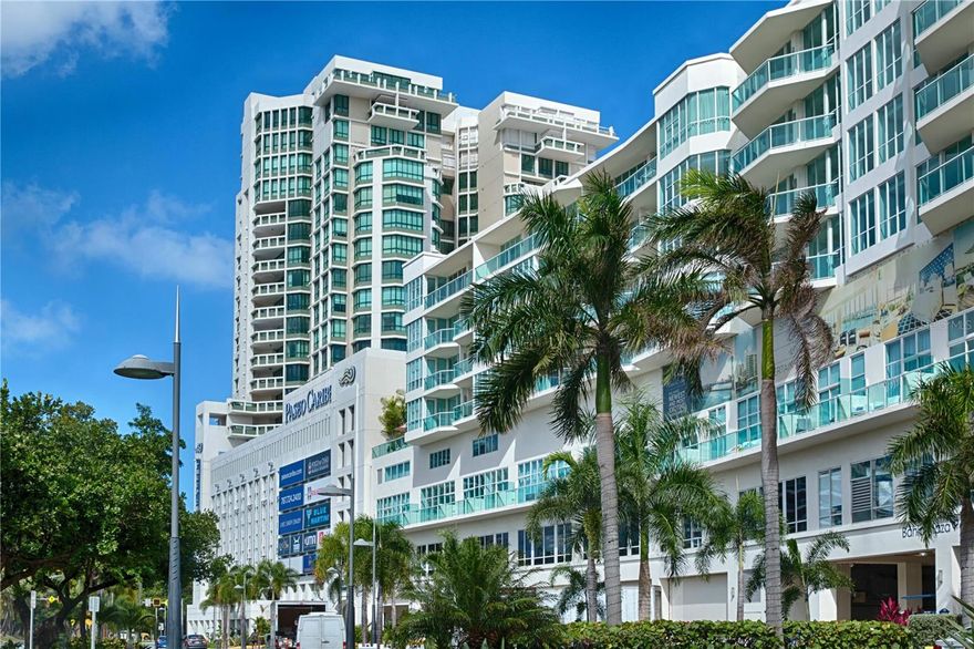 Positioned within the vibrant waterfront enclave of Paseo Caribe, this sophisticated two-bedroom, three-bathroom loft at Bahia Plaza Condominium offers a refined blend of contemporary design, expansive interiors, and effortless urban living. Spanning approximately 1,894 square feet across two levels, the residence is defined by soaring double-height ceilings, dramatic walls of glass, and an open-concept layout filled with natural light. The main living area seamlessly integrates the kitchen, dining, and lounge spaces, creating an ideal setting for both relaxed daily living and stylish entertaining. Clean architectural lines, modern finishes, and oversized windows frame captivating city and partial water views, while the private balcony extends the living experience outdoors. Upstairs, two spacious bedrooms with ensuite baths provide comfort and privacy, including a striking loft-style primary suite overlooking the grand living space below. Offered furnished and impeccably curated, the residence embodies contemporary elegance in one of San Juan’s most desirable coastal communities. Bahia Plaza residents enjoy a full-service lifestyle with amenities that include 24-hour security, concierge service, controlled access, resort-style swimming pool, fitness center, residents’ lounge, and covered parking. Perfectly positioned between Condado and Old San Juan, Paseo Caribe places residents moments from renowned dining, luxury hotels, marinas, cafes, and waterfront promenades. The nearby Distrito T-Mobile entertainment district offers concerts, nightlife, restaurants, cinemas, and year-round events just minutes away, while the historic charm of Old San Juan and the beaches, boutiques, and cosmopolitan energy of Condado remain within close reach. A rare opportunity to own a stylish turnkey residence in the heart of San Juan’s premier waterfront corridor.
