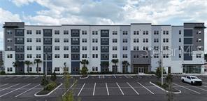 Photo of 5563 Millenia Park Boulevard #525, Orlando, FL 32839 (MLS # TB8548140)