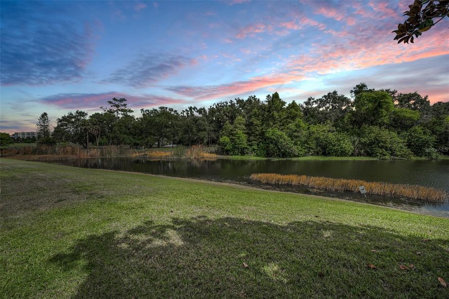 GROUND FLOOR END UNIT WITH WATER VIEWS! This spacious 3-bedroom, 2-bathroom condo with a 1-car garage offers an open floor plan main living area that features a bright living and dining area with large windows that bring in natural light and showcase serene views of the community pond. The large kitchen is designed with both function in mind, offering a closet pantry, built-in spice cabinet, and extra drawers under the breakfast bar for added storage and convenience. With plenty of cabinet space and a smart layout, it’s perfect for cooking and entertaining. The primary suite includes an en-suite bathroom with a step-in shower and a walk-in closet, while two additional bedrooms offer flexibility for family, guests, or a home office. A private screened lanai is the perfect spot to relax and enjoy the peaceful water view. Located on the first floor for easy access, this condo also comes with an attached garage and in-unit laundry. The community offers a pool and clubhouse, and you’ll love being just minutes from beaches, shopping, dining, and parks. This rare 3-bedroom end unit with a garage and pond view is move-in ready—schedule your private showing today!