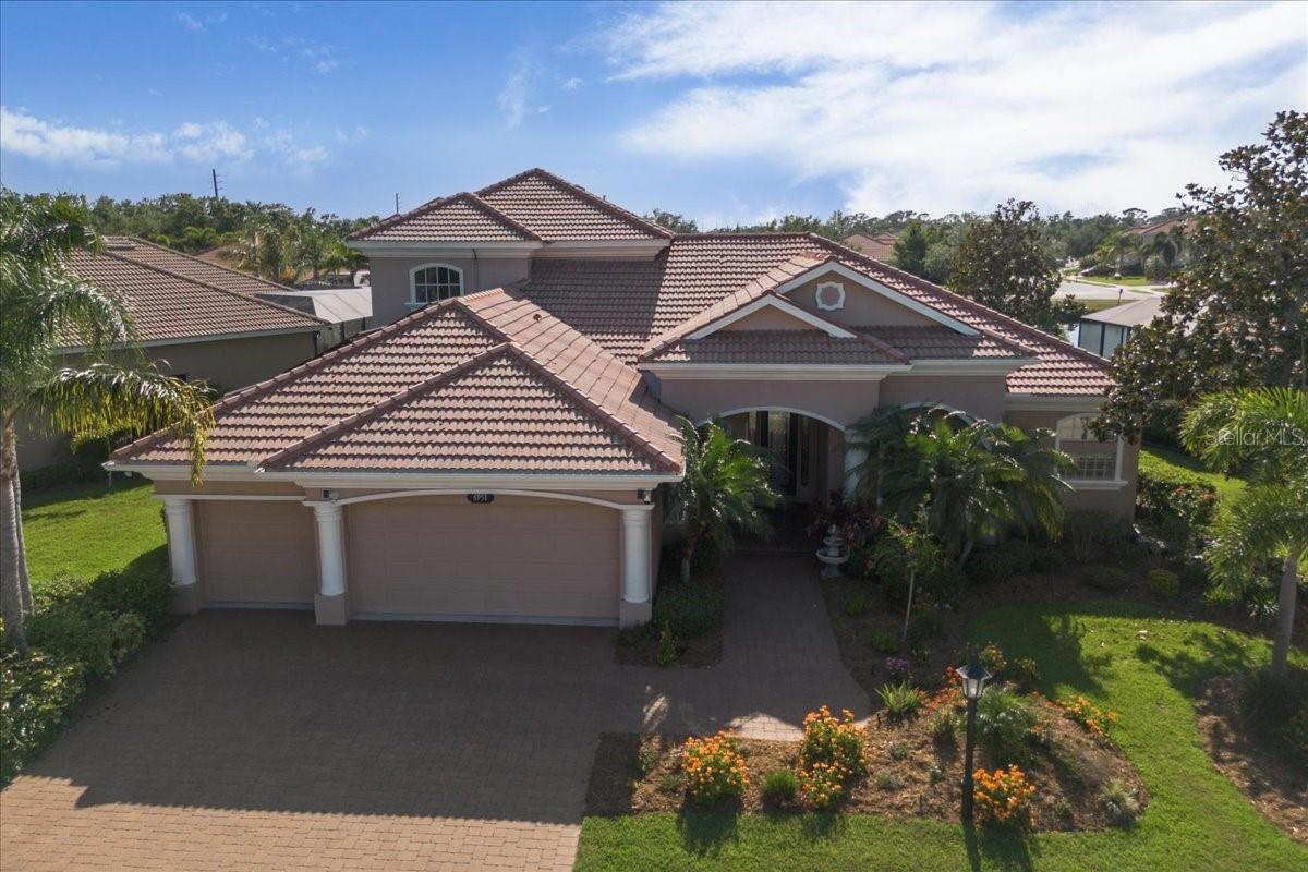MAJOR PRICE REDUCTION. PRICED TO SELL. They don't build them like this anymore! Welcome to a truly exceptional residence tucked away in Red Hawk Reserve, one of Sarasota’s most exclusive executive communities—a peaceful, private enclave where refined living and natural beauty exist in perfect harmony.
This exquisite solidly built 4-bedroom, 4-bathroom two-storey home offers everything you expect from a luxury lifestyle, featuring a whole private suite upstairs with a large bonus room to use as you please; a private guest suite, a mother-in-law suite or a second primary bedroom retreat. Heck use it as a private theatre, game room or a second living room, your choice. Step through the front door and experience a home that’s as spacious, with high ceilings, abundant natural light, and carefully crafted details throughout. Upgrades abound – start with the solar heating system which reduces your monthly power bill to mere pocket change. What is more, the sellers are living you their hot tub for your relaxation and enjoyment. Take a dip!
Whether you're working from home or indulging in a creative pursuit, the dedicated office or den provides the ideal space for focus and inspiration. And with four full bathrooms, comfort and convenience are ensured for family and guests alike. With a sparkling pool and lake view to boot - invite yourself to unwind and savor sweeping views of the tranquil lake—your own private oasis to enjoy Florida’s sunshine year-round. A generous 3-car garage offers space for your vehicles and weekend toys, with plenty of storage to keep everything in its place. This is more than just a home—it’s a lifestyle. A quiet, executive neighborhood. A peaceful lake view. And a beautifully appointed home designed for those who appreciate elegance, space, and serenity. Come experience Sarasota living at its finest. This is the one you've been waiting for.