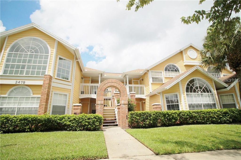 Photo of 2478 Sweetwater Club Circle #94, Kissimmee, FL 34746 (MLS # R4910114)