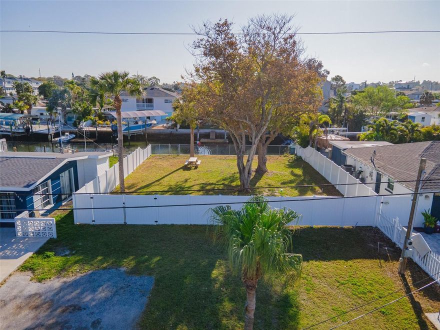 VERY MOTIVATED SELLER AND HAS LOWERED THE PRICE YET AGAIN!!  Welcome to the subdivision of HUDSON BEACH ESTATES This waterfront lot is waiting for you to build your new dream home. So close to all amenities, like Sam's Beach Bar, Ollie's on the Beach, Inn on the Gulf and more. NO FIXED BRIDGES, NO HOA, AND DIRECT GULF ACCESS!!   Lot is  60X100, is vinyl fenced, with Chain link on the water side. A floating dock, a concrete step seawall, the electric is ready to be hooked up, but the water and public sewer are already in place.  There is also a survey available for interested buyers.  Come and see this canal lot you won't be disappointed!