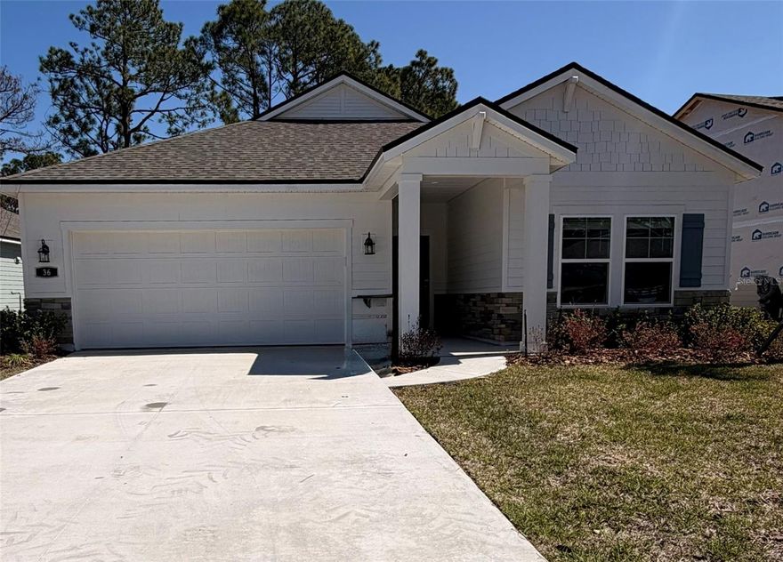 Discover the brand-new Reserve East community by Century Communities, a charming development blending small-town serenity with coastal paradise vibes—just 2 miles from the pristine shores of Flagler Beach, FL. Landscape can be included at $100.00 more per month. This stunning Coronado model offers 2,055 sq ft of modern living space, featuring 4 spacious bedrooms, 3 full bathrooms, and a convenient 2-car garage. As true new construction that's never been lived in, it boasts premium gas cooking and opens to a covered patio plus an inviting open paver fire pit area that backs up to a peaceful partial reserve—perfect for evening gatherings under the stars or quiet relaxation amid nature. Residents enjoy access to community amenities coming in the fall of 2026, (details available on the Century Communities Reserve East website), including a planned clubhouse, large pool, pickleball courts, and dog park. Flagler Beach itself delivers the best of relaxed Florida living: beautiful cinnamon- coquina sands, a laid-back surf-town atmosphere, excellent fishing and outdoor recreation, no state income tax, and easy drives to vibrant Daytona Beach to the south or historic St. Augustine to the north. Embrace this ideal coastal lifestyle in a fresh, move-in-ready home—don't miss this rare opportunity!