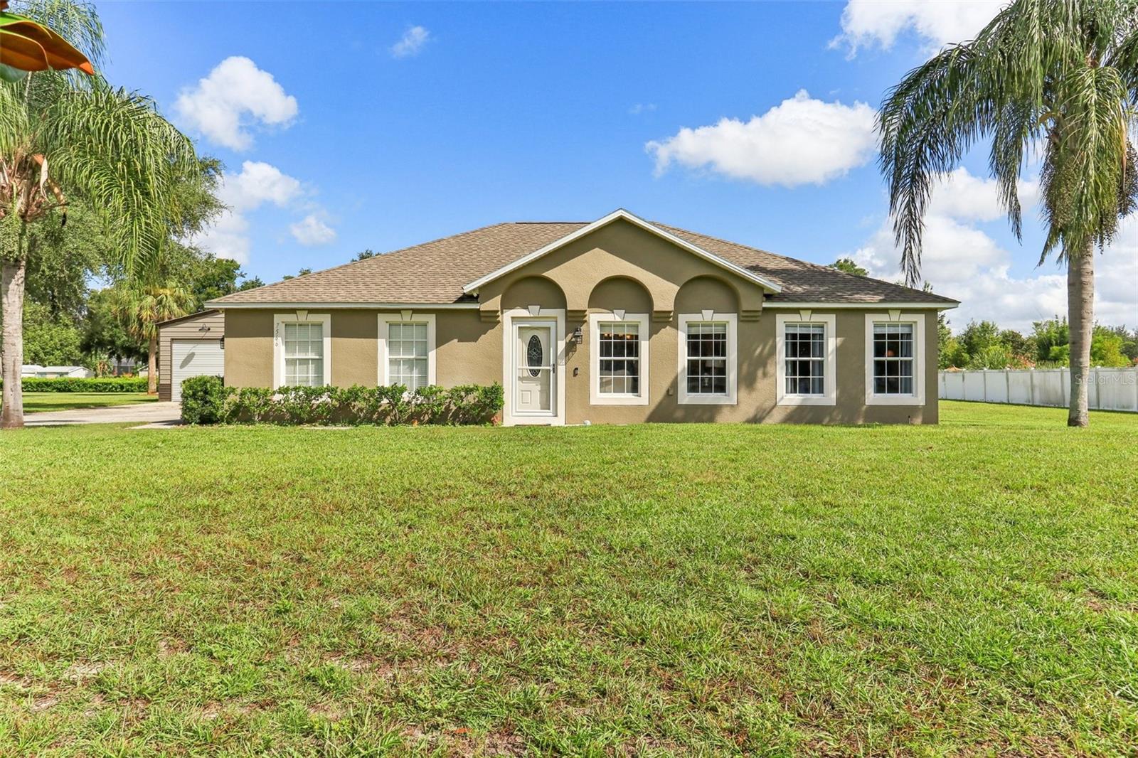 Your Mount Dora Escape Awaits – No HOA, Just Freedom & Functionality! Discover the perfect blend of space, privacy, and convenience with this move-in-ready 4-bedroom, 2-bathroom home nestled on just over an acre of land—and best of all, NO HOA restrictions! Whether you're a car enthusiast, hobbyist, or simply need room to spread out, you'll love the impressive 30x40 workshop, complete with a lift and compressor—a true rare find! Step inside your new home, to a light and bright interior with an inviting flow, featuring a formal living and dining area, plus a spacious family room open to the kitchen—perfect for entertaining or holiday gatherings. The chef’s kitchen is a dream with a large center island and prep sink, dual pantries, and abundant granite countertop space. The split-bedroom floor-plan offers maximum privacy. The primary suite is oversized with two walk-in closets and a beautifully updated en-suite featuring a garden soaking tub and walk-in shower. Plush new carpet and padding were just installed in the primary bedroom for added comfort. Step outside to your own private retreat—an inviting screened-in Pebble Tech pool (2011) with a generous sun deck and a separate 10x20 storage shed for all your extras. Roof was replaced in 2018 for peace of mind. Located just minutes from Downtown Mount Dora’s charming shops and festivals, with easy access to Orlando via the 429, this property offers the best of both worlds—quiet country-style living with city conveniences nearby. Room to roam, room to wrench, and no HOA telling you what to do—this is the lifestyle you've been waiting for! Mount Dora is a charming lakeside town known for its historic charm, natural beauty, and lively culture. Schedule your private tour today.