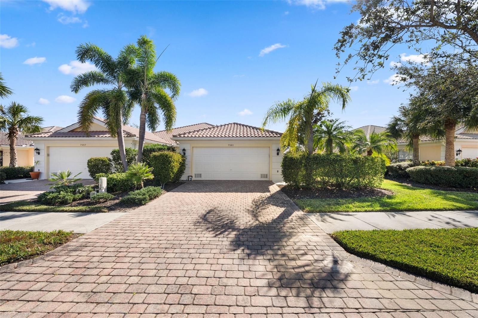 Welcome to VillageWalk, a premier gated community in Sarasota! This charming Capri III villa offers comfort and convenience with a spacious great room featuring vaulted ceilings, a built-in wall unit, and carpeted floors. The open kitchen includes ample storage, a closet pantry, and a functional layout. The primary bedroom boasts a walk-in closet with built-in organizers and an en-suite bathroom with dual sinks and a walk-in shower. The guest bedroom offers its own bathroom and walk-in closet for added privacy. Additional features include a turnkey-furnished home, central vacuum, attic storage, security system, and a well-equipped laundry room with storage and a utility sink. Built by DiVosta with reinforced poured concrete, this villa is designed for durability. Enjoy the private screened lanai overlooking a peaceful, tropical backyard. Recent updates include new accordion shutters and a 2023 hot water heater. VillageWalk offers over five hundred acres of beautifully landscaped grounds and fantastic amenities like a clubhouse with a fitness center, on-site restaurant and bar, and a range of activities like tennis, pickleball, bocce ball, and two geothermally heated pools. The community also features a salon, boutique shopping, and even a gas station. Conveniently located near Siesta Key Beach, the Legacy Bike Trail, and great shopping and dining, this villa is the ideal retreat for enjoying the Sarasota lifestyle.