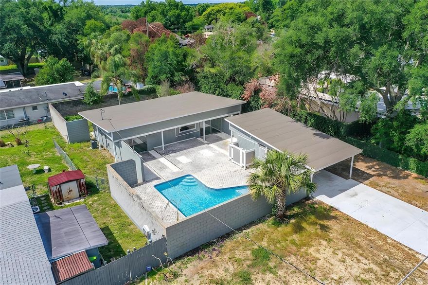 One or more photo(s) has been virtually staged. Completely renovated and move-in ready, this beautifully updated home combines modern style with everyday comfort in the heart of Central Florida.

Step inside to a bright, open floor plan filled with natural light from large floor-to-ceiling windows throughout—including in the bedrooms. The spacious living areas flow seamlessly, creating a warm and inviting atmosphere perfect for both relaxing and entertaining.

The stunning kitchen has been completely updated with beautiful soft-close cabinetry, luxurious quartz countertops, stainless steel appliances, and recessed lighting—offering a sleek, contemporary look and exceptional functionality. Luxury vinyl plank flooring runs throughout the home, complemented by fresh interior paint, modern fixtures, and stylish ceiling fans that complete the elegant finish.

The primary suite provides a private retreat, while additional bedrooms offer flexibility for family, guests, or a home office. Both bathrooms have been tastefully remodeled with updated tile, vanities, and fixtures.

Outside, enjoy your private backyard oasis—fully enclosed with a block wall for enhanced privacy. A sparkling inground pool with paver deck sets the stage for year-round Florida living, whether you’re hosting a gathering or enjoying a quiet evening under the stars.

Additional features include a separate exterior laundry/storage room for added convenience.

Ideally located near shopping, dining, schools, and major roadways, this home offers easy access to Winter Haven’s famous Chain of Lakes and other nearby Central Florida attractions.

Every detail has been updated—move right in and start enjoying the Florida lifestyle today! Schedule your private showing before it’s gone.