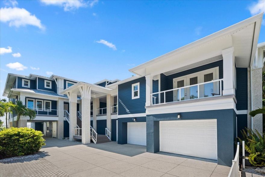 One or more photo(s) has been virtually staged.  Welcome to your own personal paradise! Step into this breathtaking waterfront oasis in Dunedin Isles, right on the Gulf Of Mexico. Prepare to be captivated by the sheer luxury and elegance of this extraordinary estate. With a total of 12,571 sq ft under roof, including 5833 heated sq ft of pure opulence, this home offers 3160 sq ft of waterfront balconies to relax and savor the coastal ambiance. Nestled within this serene oasis, the 995 sq ft guest house attached through the portico provides a private retreat, allowing your guests to feel right in their own home. This home features light oak floors and high ceilings with an inviting atmosphere, while the floor-to-ceiling sliding doors offer panoramic gulf views that will take your breath away. Indulge your senses in the chef's kitchen, complete with ample island space, a breakfast bar, and top-of-the-line appliances. Hosting gatherings becomes a breeze in this stylish and functional space. And for wine enthusiasts, the recently built temperature-controlled wine cellar adds an extra touch of sophistication with its delicate craftsmanship. Car enthusiasts can enjoy the massive garages, offering plenty of space to showcase and store their prized vehicles. The first level of the home also features a top-tier gym space, perfect for maintaining an active lifestyle. Picture-perfect sunsets await you as you unwind in the pool and spa, overlooking the tranquil waters. Immerse yourself in the mesmerizing sight of dolphins dancing as you soak up the beauty of your surroundings. With Control 4 home automation, managing your home has never been easier. Not to mention, a beautiful dock leading to TWO electrical lifts that can be home to your water crafts! Whether you choose to explore the nearby restaurants, entertainment options, Honey Moon Island, or the local golf course, you'll be immersed in the true meaning of luxury and coastal living.