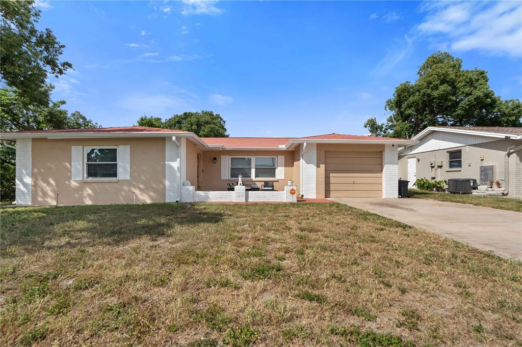 Photo of 7735 Hawthorn Drive, Port Richey, FL 34668 (MLS # W7890237)