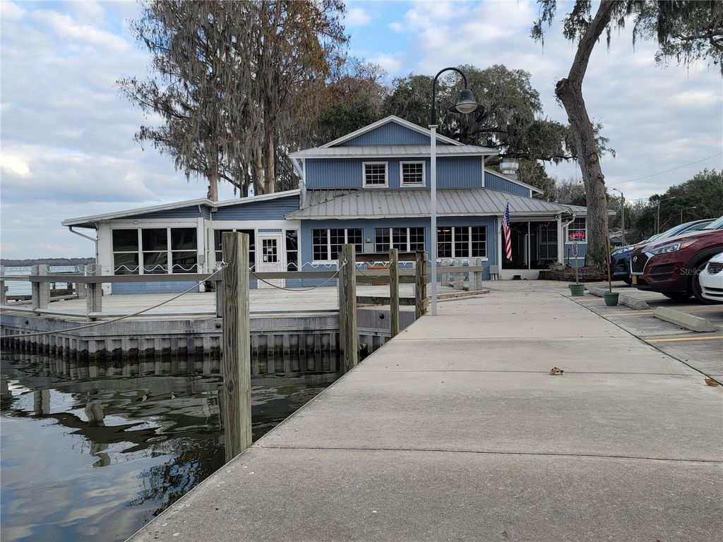 Photo of 704 S Lakeshore Boulevard, Howey In The Hills, FL 34737 (MLS # G5111363)