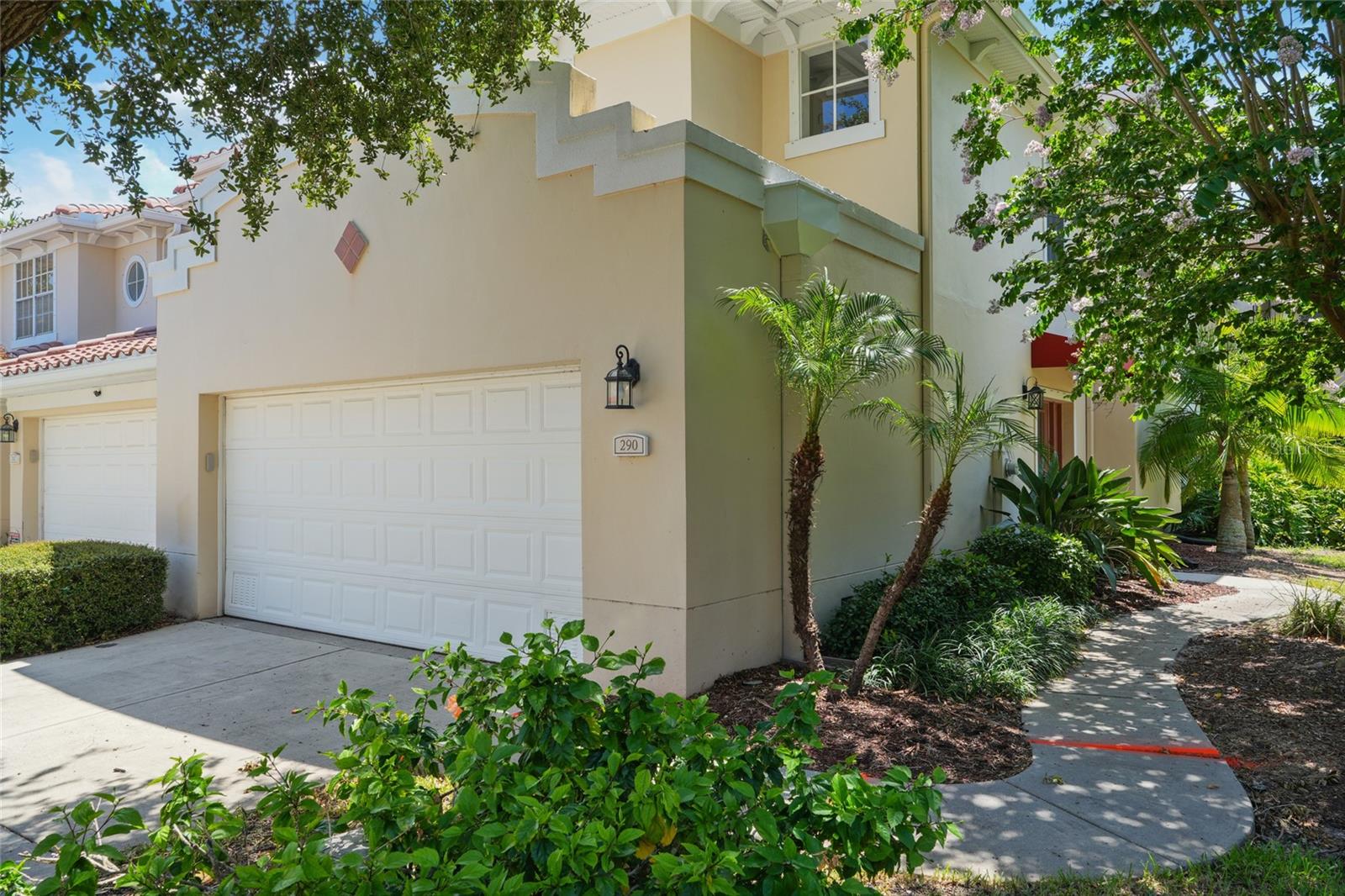 One or more photo(s) has been virtually staged. WELCOME to your beautifully upgraded end-unit townhome in the desirable Villas of Carillon community. The private front entry adds charm, while new porcelain wood-look tile floors enhance the open-concept main level. The kitchen features granite countertops, stainless steel appliances, hard wood cabinetry, and a breakfast bar, plus a spacious pantry closet for extra storage. The light-filled living area opens to a screened-in porch with a storage closet, and a convenient powder room is perfect for guests. Upstairs, wood laminate flooring flows throughout. The expansive primary suite offers two walk-in closets, French doors to a private balcony, and a luxurious ensuite with a jetted tub and expanded glass shower finished in porcelain tile and glass accents. A smart split layout includes two additional bedrooms connected by a Jack-and-Jill bath, plus a laundry room with storage cabinets. Plantation shutters throughout add style and privacy. Oversized 2-car garage with overhead storage. Enjoy the heated community pool and clubhouse. Ideally located near both Tampa and St. Pete-Clearwater Airports—plus, this home has never flooded. One or more of the photos have been virtually staged.