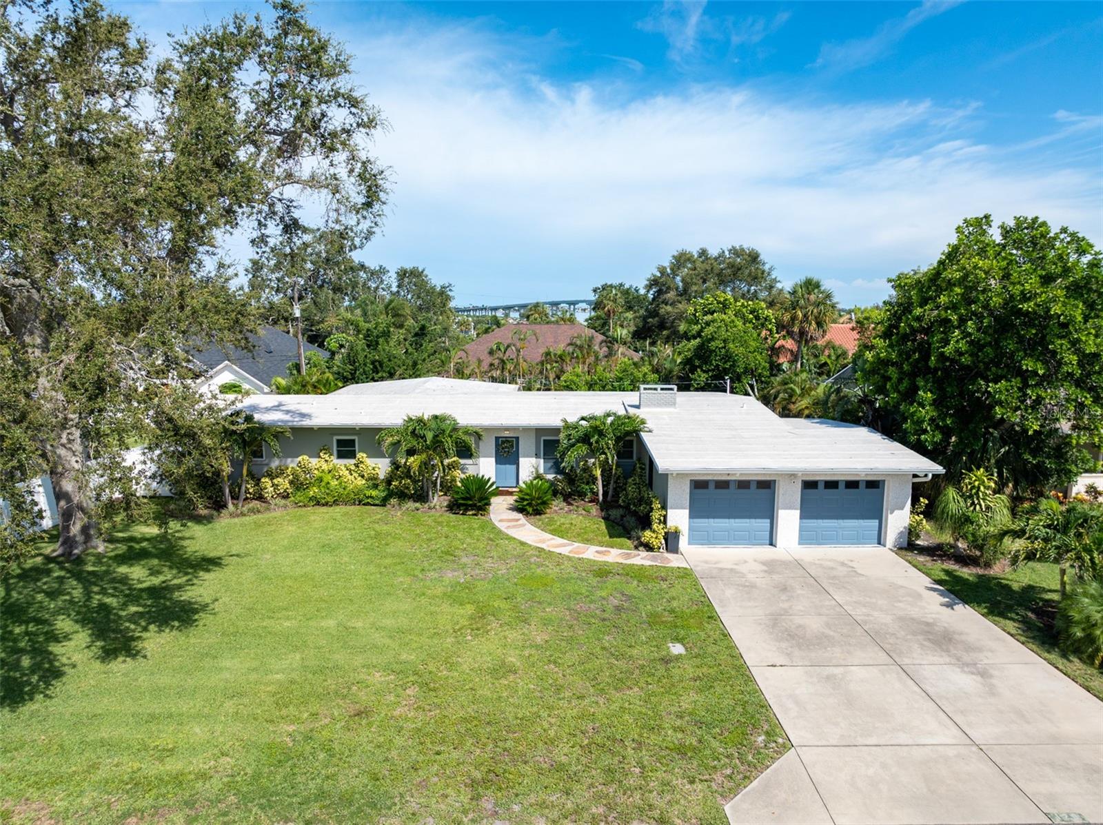 Located in one of the area’s most sought-after neighborhoods of Harbor Bluffs, this updated 3-bedroom, 2-bathroom home is just minutes from beaches, Intracoastal Waterway, public boat ramp, parks, shopping, and dining. Best of all, the property sits high and dry, outside of any flood zone. Inside you’ll find spacious, open-concept living areas ideal for both everyday living or entertaining-especially movie night with the overhead projector. A spacious breakfast bar, stainless steel appliances, built-in oven, and cooktop highlight the well-equipped kitchen, which connects to a separate laundry room. The spacious owner’s suite includes a huge walk-in closet with private access to the back deck. While the en-suite bath offers a spa-like experience with a soaking tub as well as a walk-in shower with dual shower heads. Two additional spacious bedrooms share a sleek-modern second bath room. Unwind on the the spacious deck that overlooks the fully fenced backyard and fire pit-ideal for entertaining or relaxing under the stars. Recent updates include new roof and gutters (2022), exterior paint and doors, sprinkler system, and recent updated washer and dryer. Upgraded windows throughout bring in abundant natural light, giving the home a bright and airy feel from room to room. Move in ready and can close quickly-schedule a visit today!
