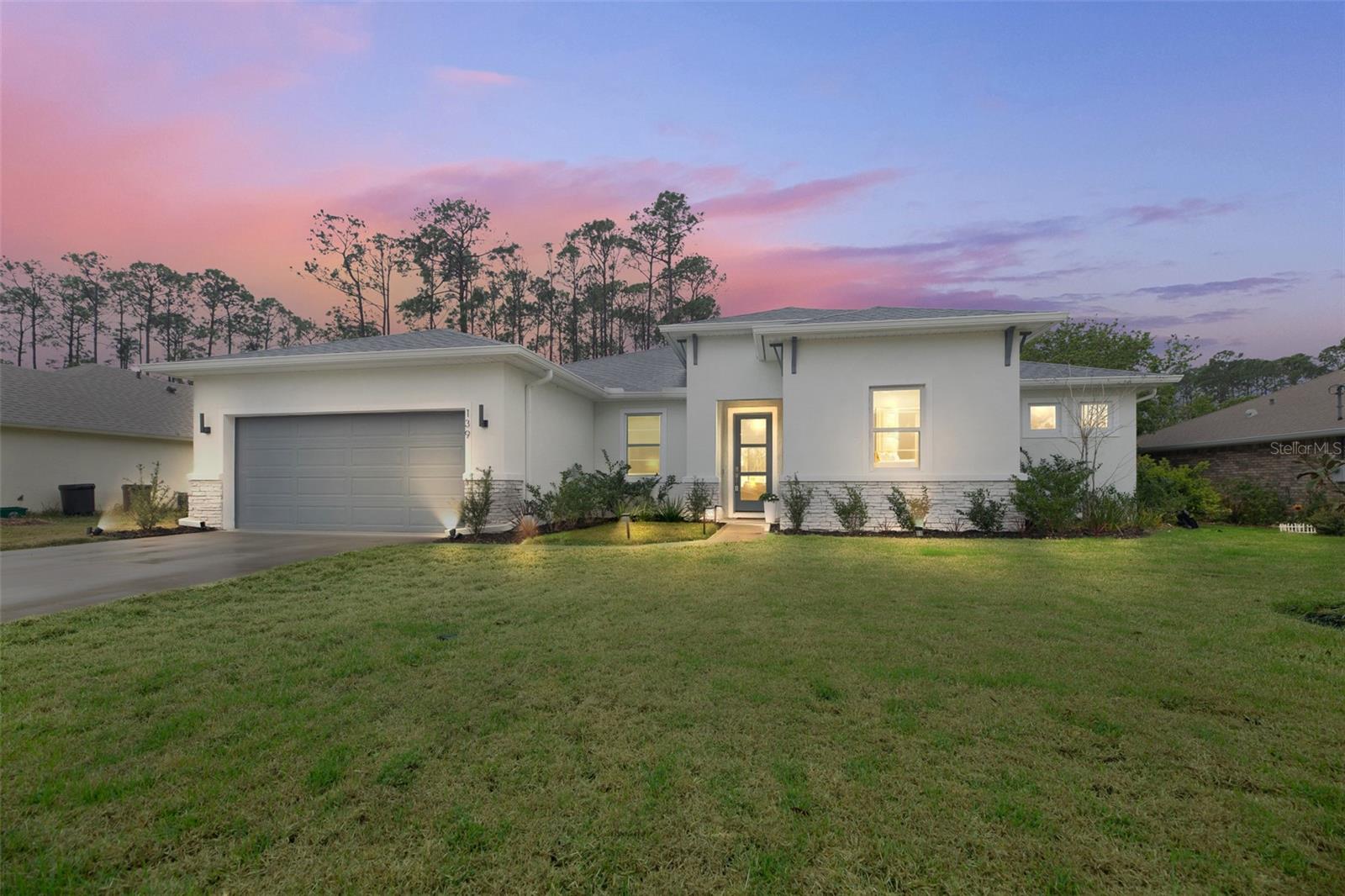 This Brite built home has an abundance of energy saving features built into the home. You'll be pleasantly surprised when you receive your electric bill. Attention to detail and finishes are impressive. Walk through the upgraded front door of this 2300+ square foot home and you'll be greeted by the open floor plan and the vaulted ceiling. This home has 4 bedrooms and 3 bathrooms plus a bonus room. Starting with the kitchen you'll say WOW! You'll understand when you find out the owner is the executive chef at the finest restaurant in the area. Pendant designer lights hang from the ceiling over the center island/ breakfast bar. The surfaces are a beautiful Quartz. This kitchen has been created to be a true gourmet kitchen. You'll create your own masterpieces here that are sure to impress your guests. You'll overlook your expansive great room while you cook. The great room measures just under 20' by 20' and will accommodate a large crowd. There is plenty of room for a large dining room table in the 12' by 14' dining room. The Primary bedroom is very spacious. You'll love the walk-in closets, and the bathroom will be your own private spa. Quartz countertops solid wood cabinets and all the finishes you would expect in a fine home. The three bathrooms in this house ensure no waiting when the need arises. They also have superior quality countertops and vanities. The spacious covered rear patio is large enough for an outside dining room table, lounge chairs, and all your BBQ grills. You'll never have to worry about privacy with a 6-foot privacy fence. You'll also appreciate the raised bed gardens in the backyard. The chef grew his own herbs and vegetables, and you can also. Know that your lawn and gardens will always look beautiful because this house has an irrigation system. The two-car garage is oversized, so you have extra room for storage. You'll appreciate living in one of the most desirable areas in Palm Coast. Don't miss an opportunity to live in a great house in a neighborhood where folks take great pride in the appearance of their homes. Stop out and see this home before it's gone.
