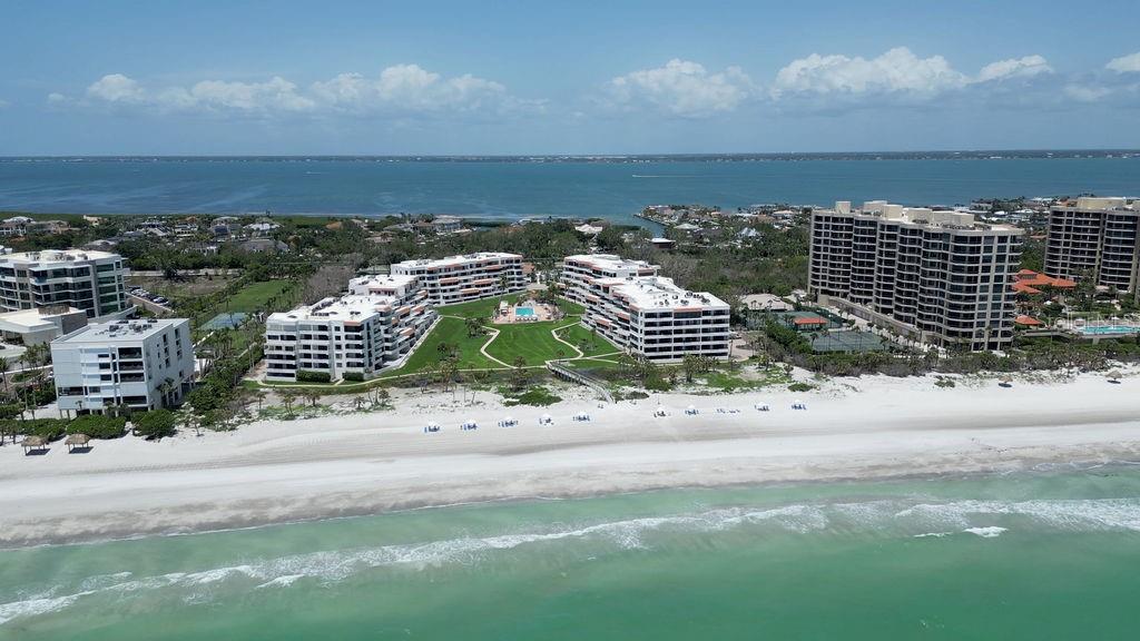 Welcome to your perfect Gulf-front getaway at The Players Club on Longboat Key. This beautifully renovated second-floor condominium offers stunning views of the Gulf of Mexico and is just steps from the pristine beach. From the moment you enter, your eyes are drawn through the spacious great room to the expansive balcony, where you can relax for hours in the fresh air—reading, listening to the waves, and taking in the breathtaking sunsets.
The interior is a seamless blend of style and functionality, fully renovated from the studs out in late 2020. Porcelain tile flooring runs throughout the unit, complemented by custom LED ceiling lighting, custom blinds, and designer touches like shiplap in the entryway. The open-concept kitchen is ideal for entertaining, featuring granite countertops, stainless steel appliances, custom cabinetry, an induction stove with convection and steam baking functions, and wine fridge.
The master suite provides a serene retreat with private balcony access, a walk-in closet with custom organizers, and a split en-suite bathroom featuring elegant custom tile and a Toto bidet in the powder area. A second en-suite bedroom, located off the front hallway, also boasts a large walk-in closet, making it a perfect space for guests. Additional conveniences include a stylish powder room with custom wallpaper and vanity, an in-unit laundry closet, and both interior and exterior storage.
This unit is being sold fully FURNISHED, with a few personal exclusions, and includes under-building assigned parking and access to convenient bike racks. Just outside your front door is a private storage closet, adding to the functionality of this well-appointed home.
Residents of The Players Club enjoy a wealth of premium amenities, including a newly renovated clubhouse with a state-of-the-art fitness center, library, catering kitchen, and both indoor and outdoor social gathering spaces. Four Har-Tru tennis courts (with pickleball capabilities), a 70-foot heated swimming pool and spa, and beautifully maintained grounds round out the resort-style offerings. The community features a security gate and on-site management, ensuring peace of mind and convenience.
Ideally located on the south end of Longboat Key, The Players Club is just minutes from the island’s Publix, the world renown St Regis hotel, and a short drive from the upscale shops, fine dining, and cultural attractions of St. Armands Circle and downtown Sarasota. This is your opportunity to experience luxurious coastal living in one of Florida’s most desirable communities.