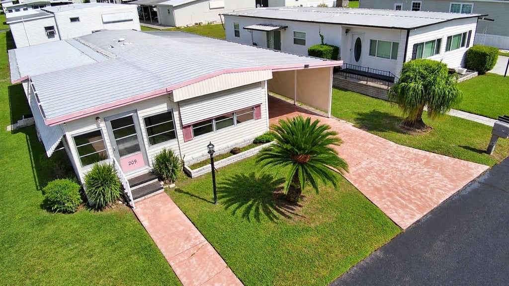 Photo of 209 Orchid Terrace, Haines City, FL 33844 (MLS # P4940069)