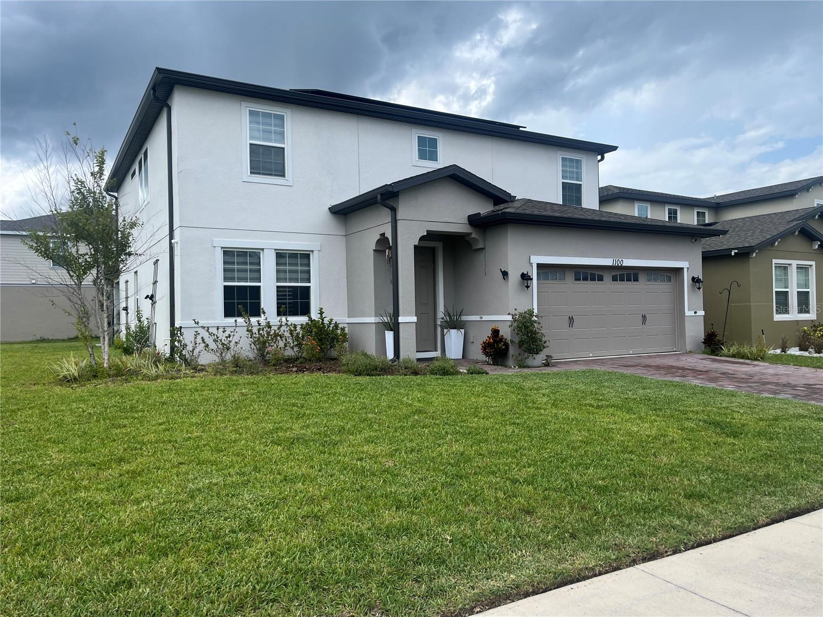 Built in 2022, this stunning 4-bedroom, 3-bath, 3,060 sq ft home in the sought-after Wiregrass community of St. Cloud blends modern style with comfortable living. The first floor showcases elegant ceramic tile, flowing seamlessly through the open-concept living and dining areas into a gourmet kitchen with sleek finishes and ample counter space, perfect for both casual meals and entertaining. Upstairs, all bedrooms are carpeted for comfort, including a spacious primary suite with a private bath and generous walk-in closet. A versatile loft offers extra living space, while the covered patio provides the ideal spot to enjoy Florida’s sunshine or evening breezes. Located in a master-planned neighborhood with resort-style amenities and close to Lake Nona, Medical City, and top-rated schools, this move-in-ready home delivers the perfect balance of style, space, and convenience.