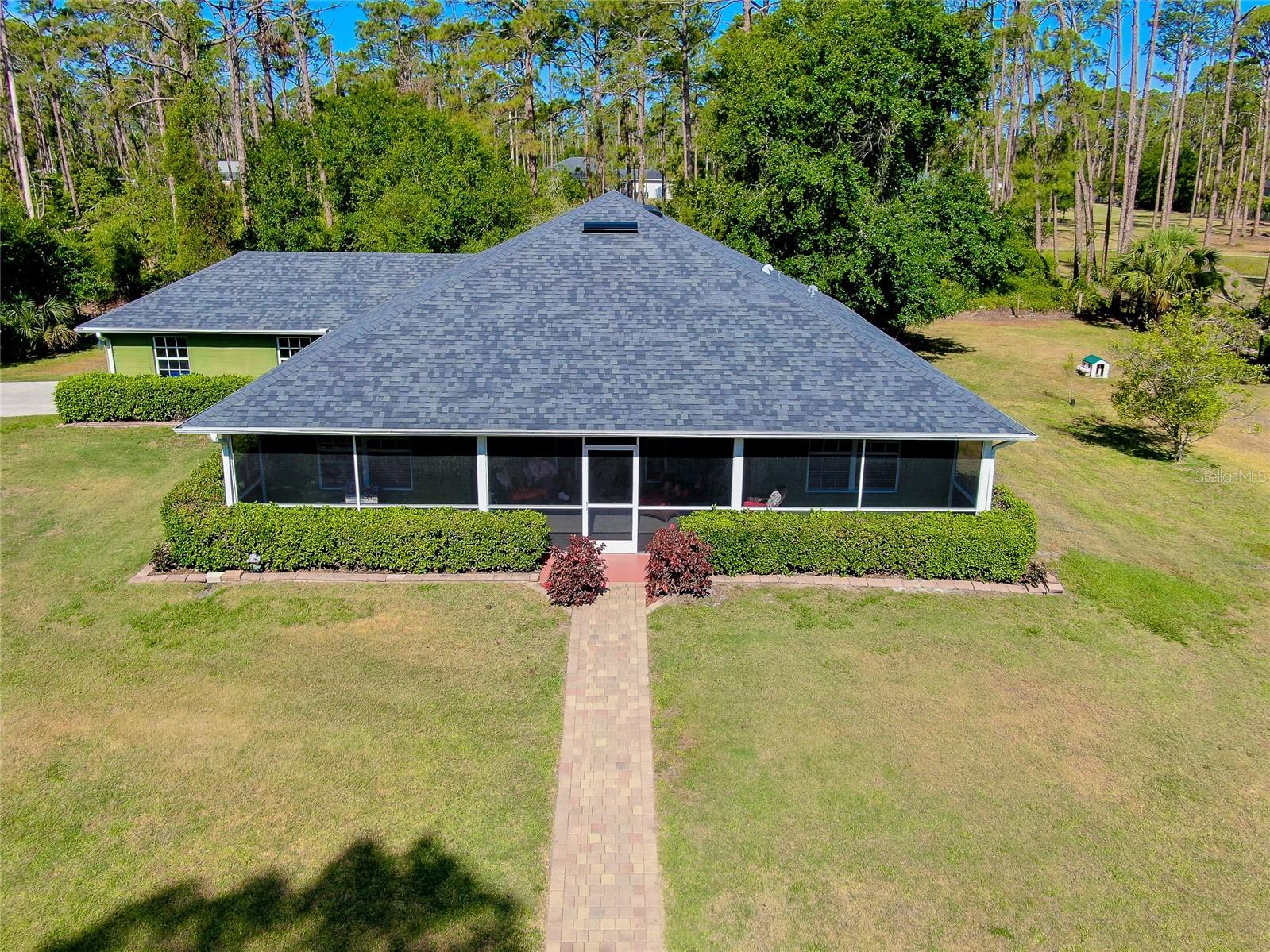 Country living on a picturesque OVERSIZED 3.01-ACRE LOT beautiful 3-bedroom, 2-bathroom home with high ceilings!. From the moment you arrive, through the wagon wheel PRIVATE GATED ENTRANCE to the CIRCULAR DRIVEWAY welcomes you to a tranquil setting framed by mature trees and a serene entryway, creating a perfect escape. NEW GUTTERS INSTALLED, ROOF ONLY 2 YEARS & NEW WATER SYSTEM INSTALLED! BARN/STABLES FULLY EQUIPPED!
Step inside to find soaring vaulted ceilings that enhance the spacious feel of the open living areas. Both front and back enclosed porches features ideal spots to relax year-round and take in the beauty of the surrounding landscape. The kitchen and dining areas flow naturally, perfect for family meals or entertaining guests.
The property also features a two-car garage and a BARN/STABLES—ideal for storage, hobbies, or even your own small homestead setup. With a peaceful pond upon entering, this home offers not only space and privacy, but a lifestyle rooted in nature and tranquility.Whether you’re looking for a weekend getaway or a forever home, this country charmer delivers comfort, space, and endless potential.