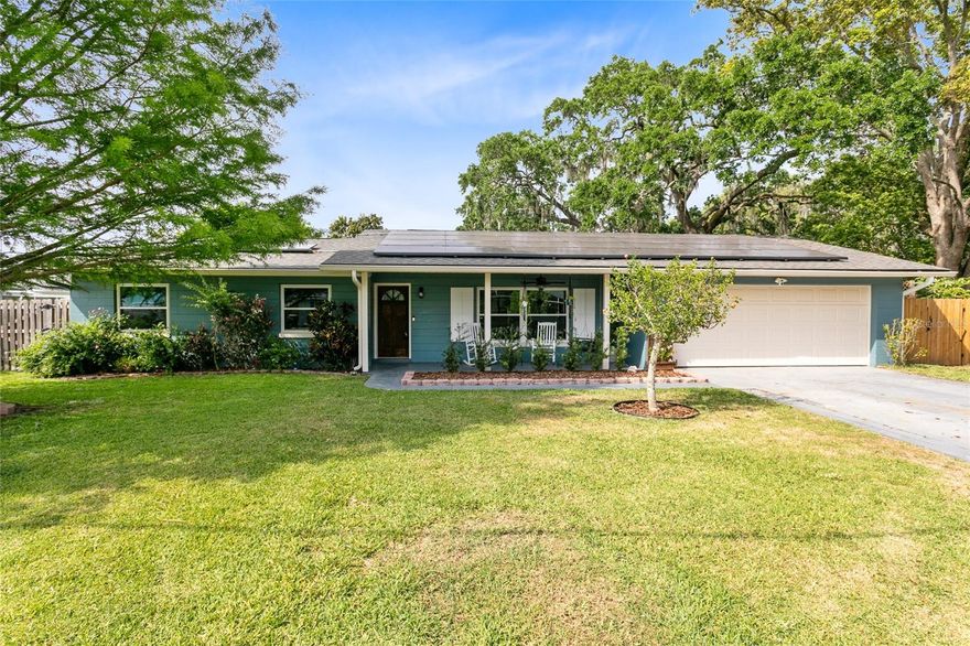 Enjoy the landscaped walkway to your new front patio with custom wood ceiling and plenty of sitting space which is a wonderful place to relax. This lovely 3-bedroom, 3-bathroom home with detached Workshop/Office is located 2 blocks from the Saint Cloud Lakefront Park. Once you walk through the front door into the foyer, you'll be pleasantly surprised by the spacious layout. There is a formal dining area off to the side that accesses the kitchen and offers a walk in closet storage area. The kitchen was recently updated and boasts a passthrough window to the backyard, solid wood cabinets, granite counter tops and newer appliances! The custom Built-In dinette area is perfect for those holiday get togethers and family dinners. Head through the living area to the Family room that showcases a projector AND screen to watch your favorite movie or Sport game. The hallway adjacent from living room accesses all 3 bedrooms, and a full guest bathroom. The Master bedroom with dual closets and bathroom en suite with walk-in shower is fit for a king! The adorable utility area with shelving sits just off of the kitchen and leads to the garage where you will find 1 of the bathrooms. The dinette area leads out to the rear wooden deck covered patio and opens to the fenced in backyard with firepit, detached block Workshop/Office. The Workshop/Office offers electricity, window unit A/C and was recently drywalled. There is an outdoor covered Grill area that is perfect spot for the BBQ Grill or Smoker. But wait, there is still so much more! In 2020 the A/C, Roof and Storm/Hurricane proof windows were installed. If that didn't do it for you then how about in 2021 PAID OFF Solar Panels were installed and significantly REDUCED the electric bill! The fenced backyard features a garden with a well for irrigation and a fire pit for those chilly winter night. Schedule your showing today and live within a short distance of gorgeous sunrises and sunsets, a sandy lakefront beach, 4 miles of walking paths, 2 piers, a marina and restaurant at the Saint Cloud Lakefront.