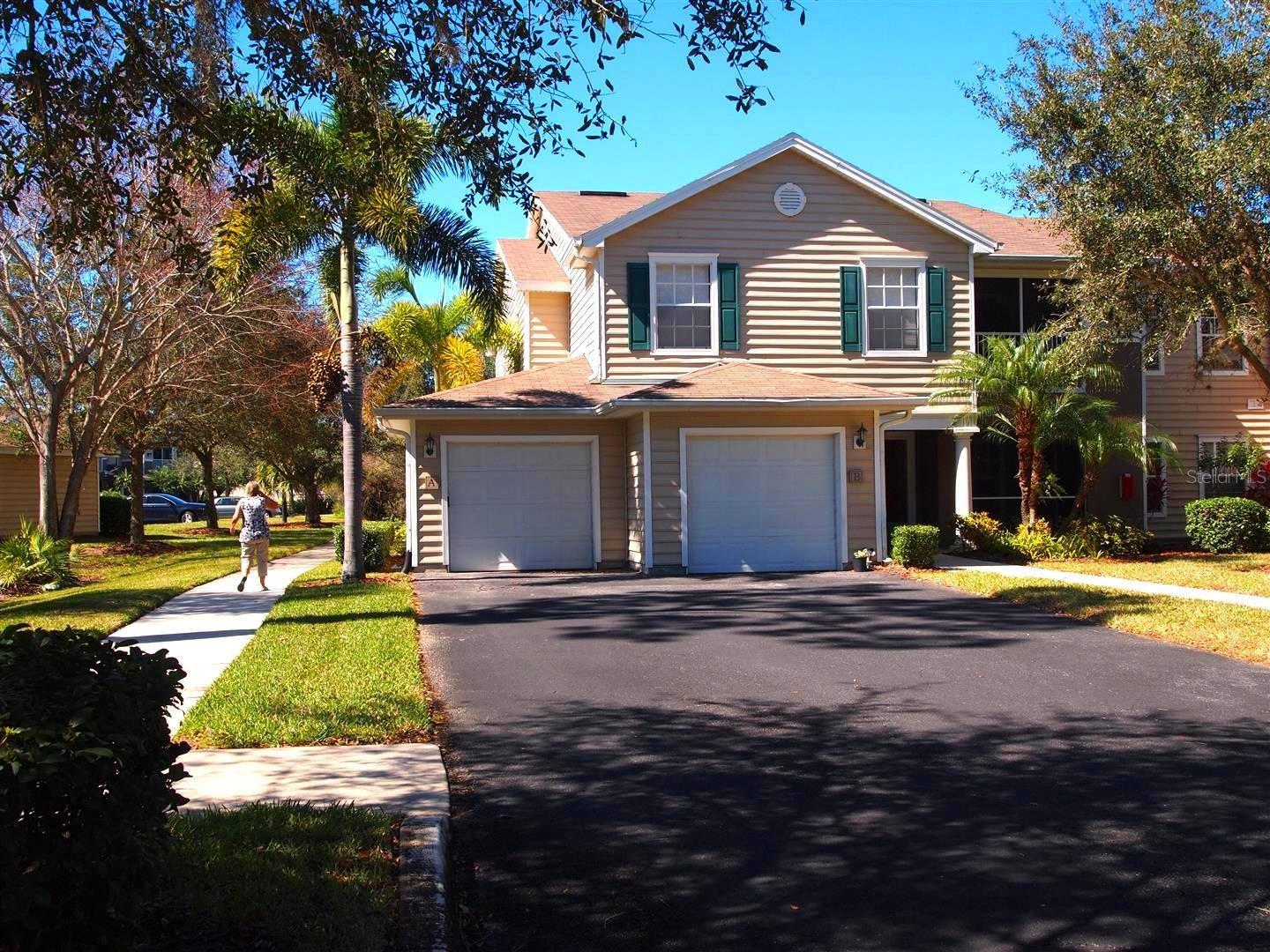 Welcome to your perfect home in the heart of Lakewood Ranch! Immediate move-in. This delightful, unfurnished second-floor end unit condo is available for yearly rental and offers 3 spacious bedrooms—each with its own walk-in closet, 2 full baths, and an attached one-car garage. Enjoy the abundance of parking and step into a freshly painted 1,324 square foot retreat. Start each morning sipping coffee on your screened lanai overlooking a tree-lined front yard, complete with an extra storage closet. The open-concept layout is designed for modern living, featuring a versatile great room with a cozy office nook, open to the dining area and kitchen, perfect for entertaining or relaxing after a long day. No carpet her, just easy-care tile floors throughout, blinds on all windows, and ceiling fans galore to keep you cool. Furry friends are welcome. Washer/dryer in laundry closet. Pest control (inside and out), and an on-site manager, life here is truly carefree. The Village at Townpark offers resort-style amenities that make every day feel like a getaway. Swim in the sparkling large heated pool, unwind in the spa, host gatherings in the charming clubhouse, or enjoy a friendly game of volleyball. Grills for cookout, nice size playground. Take a sunset stroll around the picturesque lake with walking trails and peaceful benches. Lakewood Ranch is a lifestyle. Recognized as the #1 top-selling, multi-generational, master-planned community in the U.S., it puts shopping, fine and casual dining, entertainment, medical facilities, the farmers market, and UTC Mall just minutes from your door. A rated schools. Enjoy over 150 miles of walking and biking trails, endless activities for every age, and easy access to downtown Sarasota, SRQ Airport, Siesta Key, and world-famous Gulf beaches just 25-minute drive away. Don’t miss your chance to call this friendly community home. Come and experience the Lakewood Ranch lifestyle for yourself!