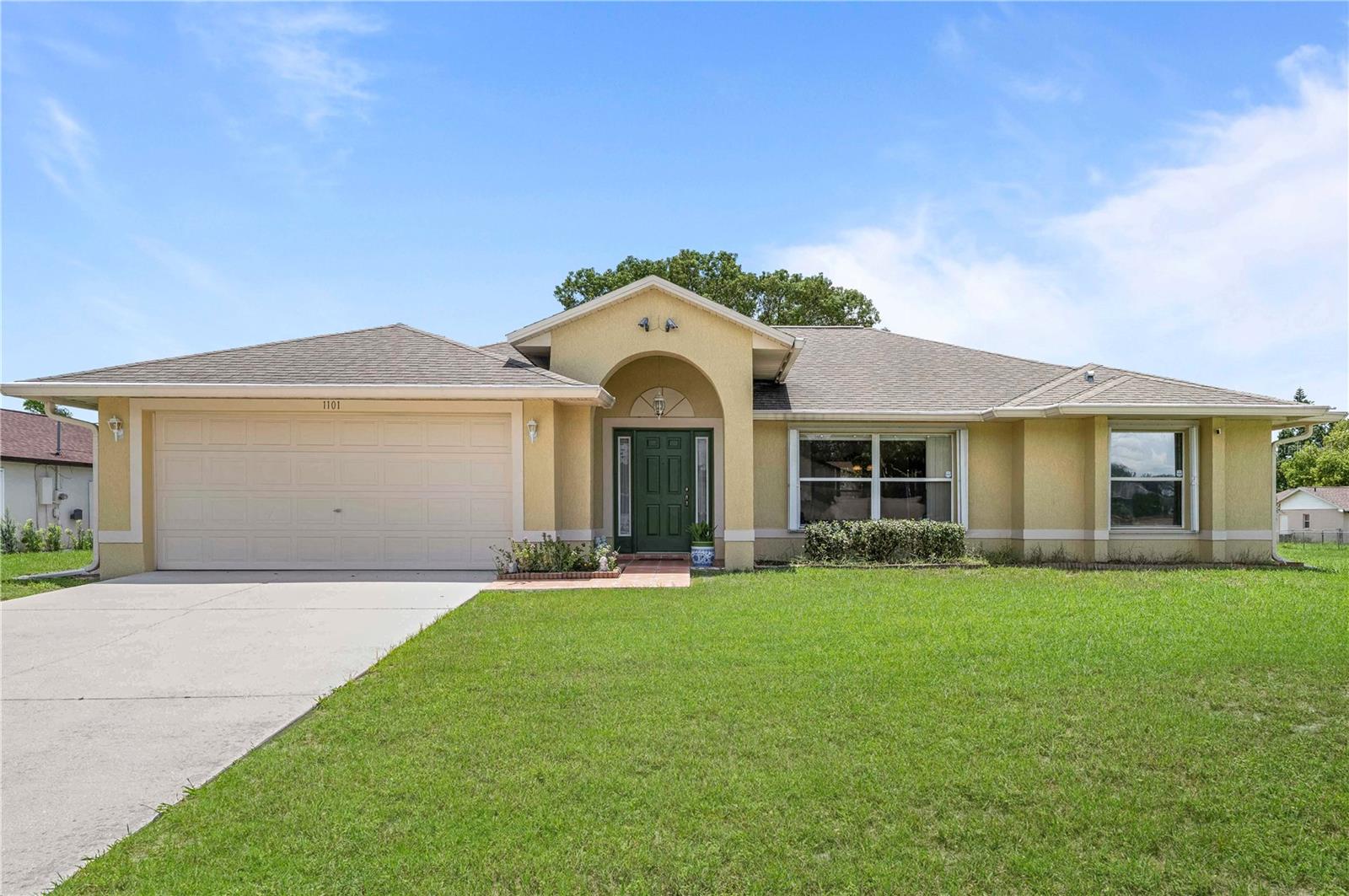 Welcome to this beautifully maintained single-owner home offering over 1,820 square feet of comfortable, under-air living space. Situated on a spacious corner lot in a quiet, established neighborhood, this 3-bedroom, 2-bathroom home provides both functionality and charm. The formal living and dining rooms offer plenty of space for entertaining, while the eat-in kitchen—featuring ample counter and cabinet space—flows seamlessly into the main living area, making everyday living a breeze. Large windows throughout allow for an abundance of natural light. The primary suite is a true retreat, boasting a generously sized bedroom, large walk-in closet, and a tastefully designed ensuite bathroom complete with dual vanities, a soaking tub, and separate walk-in shower. Secondary bedrooms are spacious and share a well-appointed guest bathroom with a tub/shower combo. Located just minutes from I-4, this home offers easy access to Orlando, Sanford, and Daytona Beach. Enjoy proximity to local parks, shopping, dining, and schools—all while tucked away in a peaceful residential setting. Whether you're commuting or looking for a serene place to call home, 1101 Anderson Street is the perfect blend of convenience and comfort.