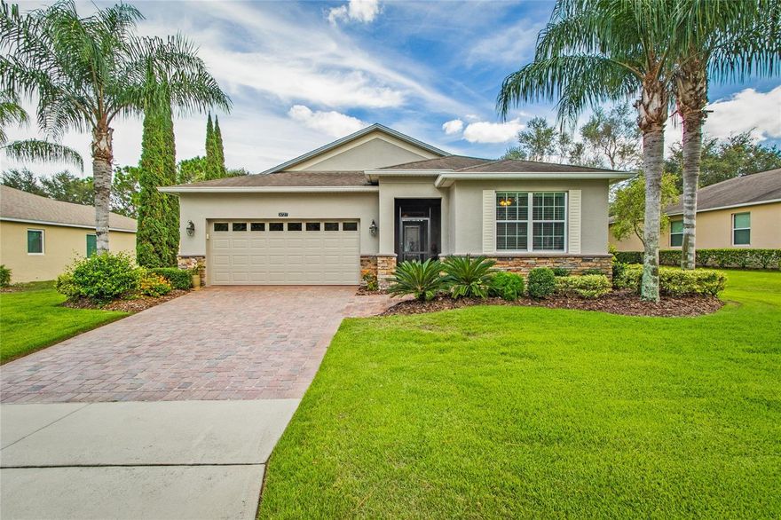 NEW ROOF 2023!! If you are interested in a absolutely gorgeous home located on a premium piece of land with an incredible view this is for you!  Either the back screened in lanai or open patio are the perfect spots to sit and relax at the start of the day with your coffee and watch the sunrise.  If you are a night owl, no worries, bring your glass of wine and sit on your patio and watch the fireworks every night or sit on your comfy couch and watch them from your living room,  the view is outstanding.  The 20' glass sliders that form the back wall of the living room make this easy to do.  Entertaining guests is also easy when you open the sliders and make the living room and lanai into one huge entertainment area. This home has to many extras to list!  Make sure to view the pictures.  Just a few to mention are a brand new roof, custom pantry with pull out shelves, closets with extra shelving, decorative & custom painting, window boxes, crown molding, chair rails, sky lights, also all custom window treatments stay with home.  Completely new master bath with heated towel racks and two separate vanities,  porcelain plank floors throughout main living area, screened in front foyer, fantastic landscaping and so much more.    Sit back and relax, the HOA covers all lawn mowing, re-mulching of garden twice a year and painting of exterior of home every five to six years. Heritage Hills is a 55+ active community built in the rolling hills of Clermont. A gated community built by Lennar Homes that is flavored with the charm of the Mediterranean and is complete with a resort style heated pool and spa, tennis and pickle ball courts, basketball, shuffleboard, bocce courts and so much more! Inside the grand clubhouse you will find a 24-hour fitness center, exercise room, craft room, library, card rooms as well as a Ballroom with stage and kitchen for special events. Additionally, there is a 5-mile walking trail around the community. Conveniently located for easy access to all attractions and highways as well as shopping, dining, medical facilities and services galore. Just a few minutes' drive to the center of Clermont or use the back gate for a shopping/dining excursion to Winter Garden shopping. Easy access to main roads from this beauty.  Act fast, this gem will not last!