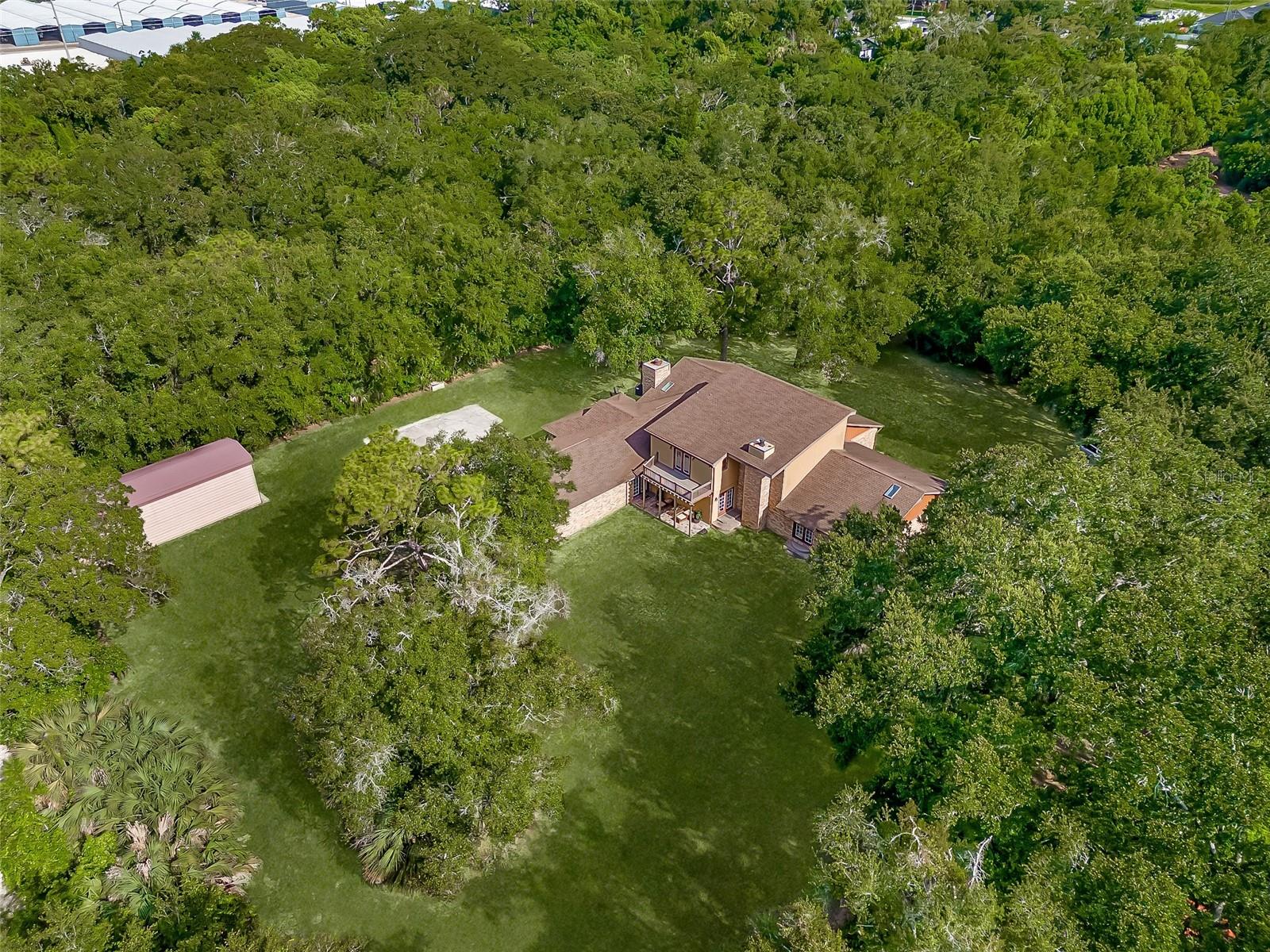 Your Own Private Retreat on 1.5 Acres – Room for Horses, Toys, and Multi-Generational Living! Secluded 1.5-acre estate offering privacy with spacious, flexible living. The main home features an open-concept layout with high ceilings, large windows, and upscale finishes. Includes a massive 30+ ft recreation room, perfect for a theater, game room, or office. A second master suite with private bath plus an additional private suite with bedrooms and full bath make this home ideal for multi-generational living. Upstairs loft offers space for a gym, movie room, or lounge. Enjoy a 3-car garage, RV parking, and room for boats or horses. Located minutes from Altamonte Springs amenities including parks, shopping, and dining. Recent appraisal at $1M—walk in with equity. Roof is 7 years old. Property combines the feel of country living with city convenience. The home appraised at 1 million, so Buyer will walk in with equity. Roof is 7 years old.