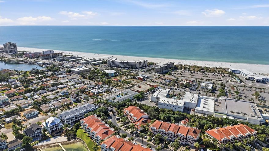 Live every day like you’re on vacation in the Exclusive Mirabella Waterfront Community.
Discover the ultimate beachside lifestyle steps from St Pete Beach in the prestigious Intracoastal waterfront community of Mirabella. This spacious townhome features 4 bedrooms and 4 full baths, offering abundant space for family, guests, or entertaining in style. The luxurious primary suite boasts vaulted ceilings and two generous walk-in closets, combining elegance with practicality.
The open kitchen on the 2nd floor flows effortlessly into the living area, extending seamlessly to a private screened balcony—perfect for enjoying meals, sunsets, or casual gatherings. Each floor includes a guest bedroom with its own full bathroom, ensuring privacy and comfort for everyone.
The fourth bedroom, a versatile MOTHER-IN-LAW SUITE on the first floor, features a private entrance and a large sliding door that opens to a secluded patio. Ideal for outdoor dining, grilling, or relaxing, this space can also serve as a home gym,  home office, or game/theater room to suit your lifestyle.
Located just a 5-minute drive from the beach—or a leisurely 10-minute walk to the iconic Don CeSar—this home’s location is unbeatable. Downtown St. Petersburg is only 20 minutes away, and Tampa International Airport is just a 30-minute drive. The community offers a heated pool, a kayak launch area, and a fishing pier for residents to enjoy. Perfect as an income property, this home allows rentals with a minimum 3-month lease. Mirabella is also pet-friendly, welcoming up to two pets with no weight limits. Whether you’re seeking a serene beach getaway or a full-time Florida residence, this property embodies relaxed coastal living at its finest. Schedule your showing today and make your beachside dreams a reality. Recent updates include a brand new tile roof (2021) AC replacement (2022), Exterior of building painted (2025), New Carpet upstairs (2025), ensuring peace of mind for the new owner.