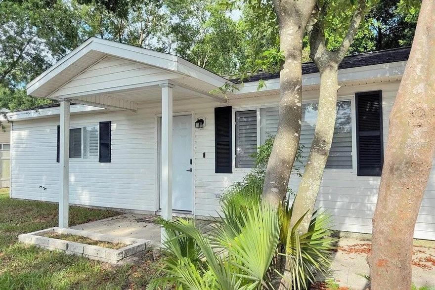 Welcome to 6500 SW 60th Avenue in Ocala’s Bahia Oaks neighborhood. This 2-bedroom, 2-bath home offers approximately 912 square feet of living space on a generously sized 0.25-acre lot, giving buyers a chance to enjoy manageable interior living with extra room outside. Built in 1996, the home features an open living and dining area, a galley-style kitchen, and a layout that works well for someone looking for a primary residence, seasonal Florida home, or lower-maintenance investment property. This home features a screened rear porch, shaded yard, and attached 1-car garage, adding functional outdoor space and everyday convenience. Located in Southwest Ocala, this property offers a practical option for buyers searching for an affordable 2-bedroom home with a yard in the 34474 area.