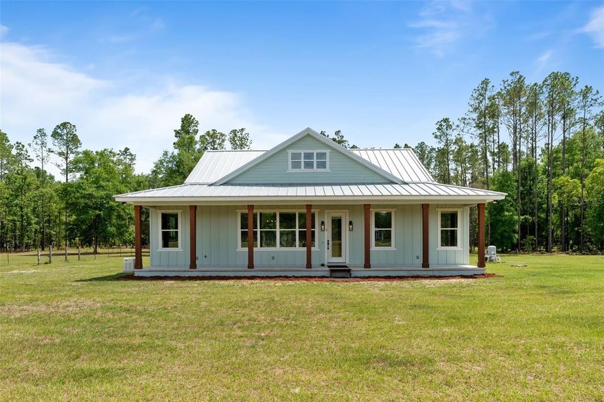 Country living at its best and on a paved road!  The most amazing 2100 square feet home built in 2021 on 10 acres with 3 bedrooms and 2 baths.  Four point for insurance was just completed.  This is a high and dry Gilchrist county home.  It is stick built, on a raised slab,  with a 24 gauge standing seem metal roof and 24kw whole house generator.   It truly has it all.  Hardee outside, luxury plank flooring through out the house, tile bathrooms, claw foot tub, massive European style multi head primary bedroom shower, huge walk in closet, lots of natural light, on demand hot water heater, salt free water filtration system, climate controlled attic/storage space, front and back porch, high fenced garden, cash crop pine trees in back, newly planted fruit trees in the front, out door shower, underground propane tank and fenced dog run.   Then there is the kitchen!  You have to see the butcher block counters, perfectly placed island, long winding breakfast bar, large pantry, massive single basin caste iron sink, electric cook top, matching appliances, beautiful white cabinets and 10 foot high ceilings.  The property is a 15 minutes drive to High Springs and Newberry.  It is within 15 minutes of multiple springs and river boat ramps.   Only a 30 minute drive to Gainesville.  Also, there is a recent passing 4 point in attachments.   Take a look at the amazing video and then come out and see what could be your forever home!