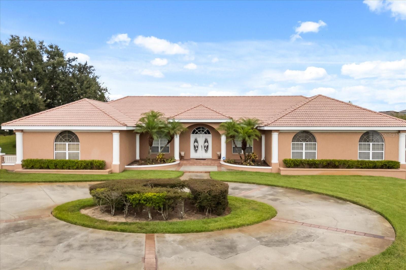 Enjoy peaceful lake views, privacy, and room to breathe in this well-maintained pool home on an oversized lot with an additional parcel offering deeded canal access to Little Lake Hamilton. Ideal for those looking to simplify without sacrificing comfort or lifestyle.
Inside, the open floor plan offers 10-foot ceilings, tile flooring, and plenty of natural light. The spacious kitchen features updated stainless appliances, a breakfast bar, and cozy nook, flowing easily into the living area with a gas fireplace and wide lake-facing windows.
The split-bedroom layout includes a large primary suite with walk-in closet and en-suite bath. All secondary bedrooms are generously sized, and the fourth bedroom is oversized—perfect for guests, hobbies, or a second living space.
Outdoors, relax on your screened lanai with pool, spa, and built-in outdoor kitchen. A side-load oversized garage, circular driveway, and fenced yard offer convenience and flexibility. The added parcel enhances privacy and provides private canal access for kayaks or small boats.
Located minutes from shopping, dining, and medical services, this home offers low-maintenance living in a beautiful lakeside setting.