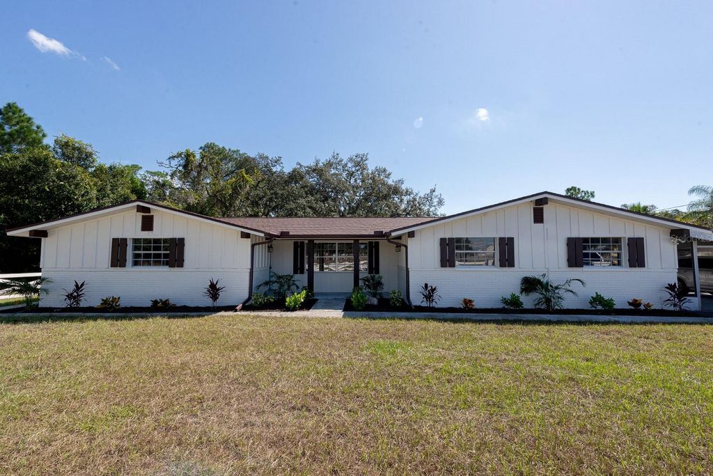 Photo of 9640 Hilltop Drive, New Port Richey, FL 34654 (MLS # TB8440745)